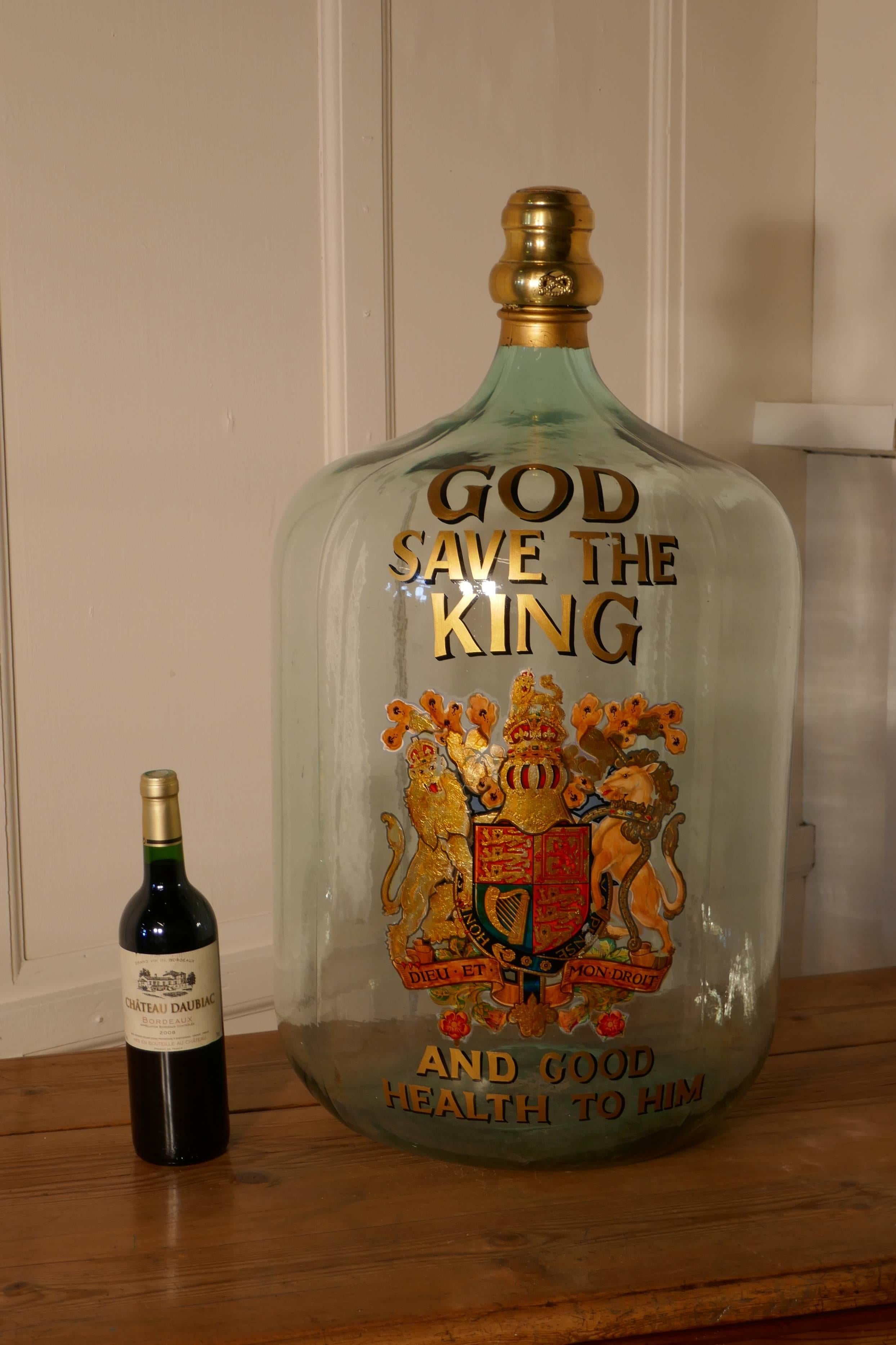 Very rare huge glass brandy/rum navy grog jar, Royal appointment to the King


This is a huge glass navy grog jar, on the front there is the Royal appointment to the House of Windsor and above it says “God Save the King” and beneath it says and