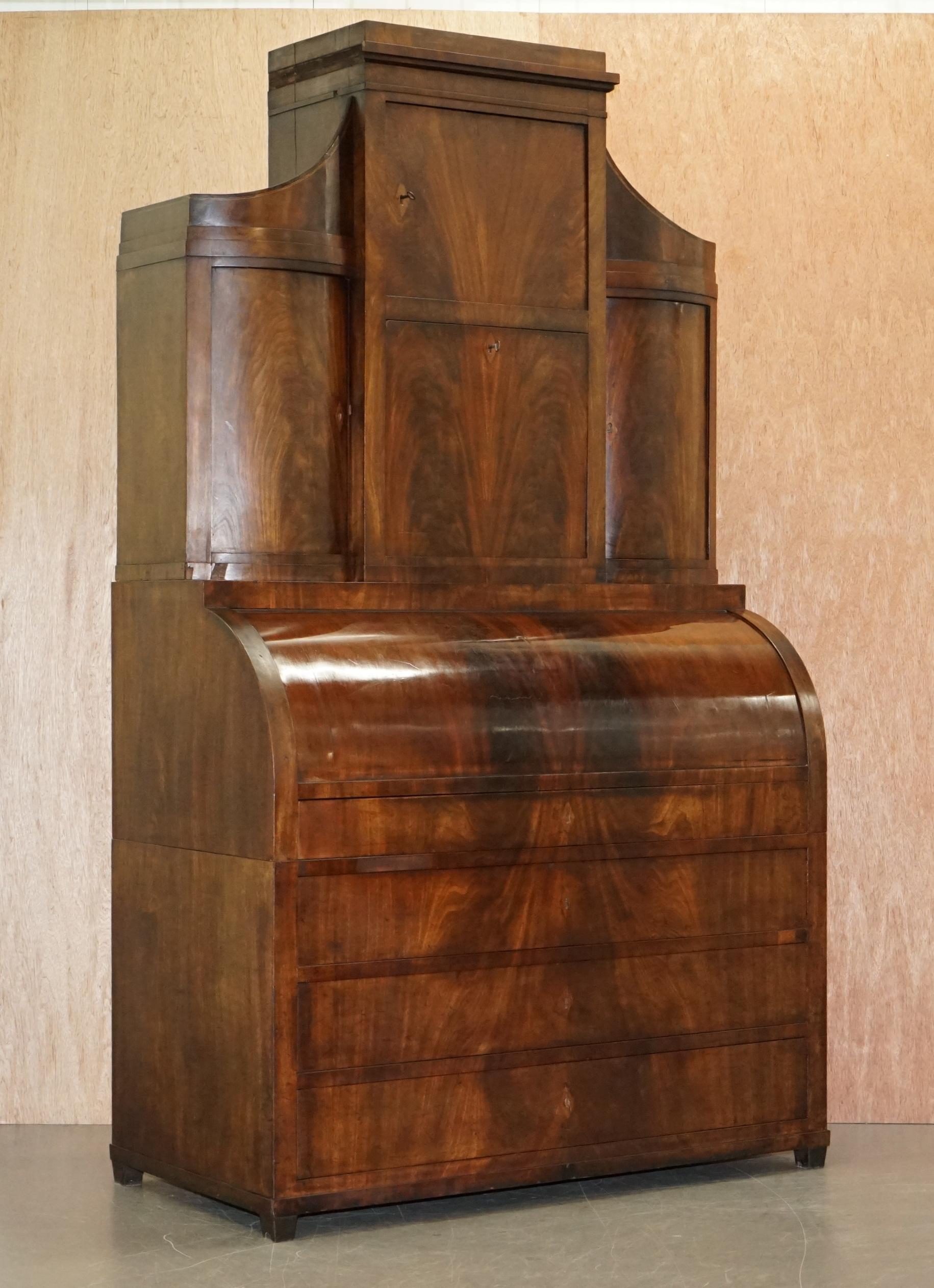 We are is delighted to offer for sale this very fine 19th century Italian cylinder top Bureau bookcase with ornately inlaid internals

This is one of the finest flamed mahogany cylinder top desks I have ever seen, its early 19th century circa