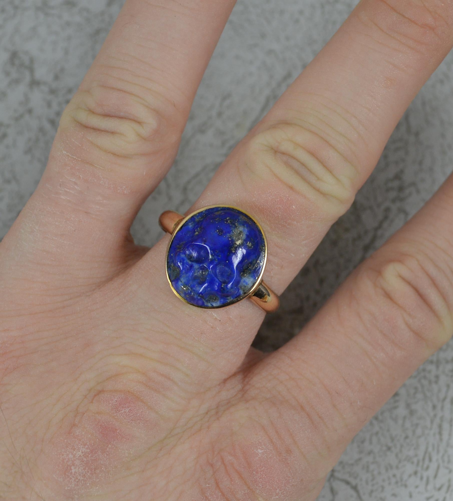 A stunning example of a Georgian style Momento Mori ring.
Designed with a single, oval shaped skull head in lapis lazuli. 14.5mm x 16mm. 
Solid 14 carat gold shank, a lovely chunky example.
​
CONDITION ; Very good. Clean and polished band. Well set