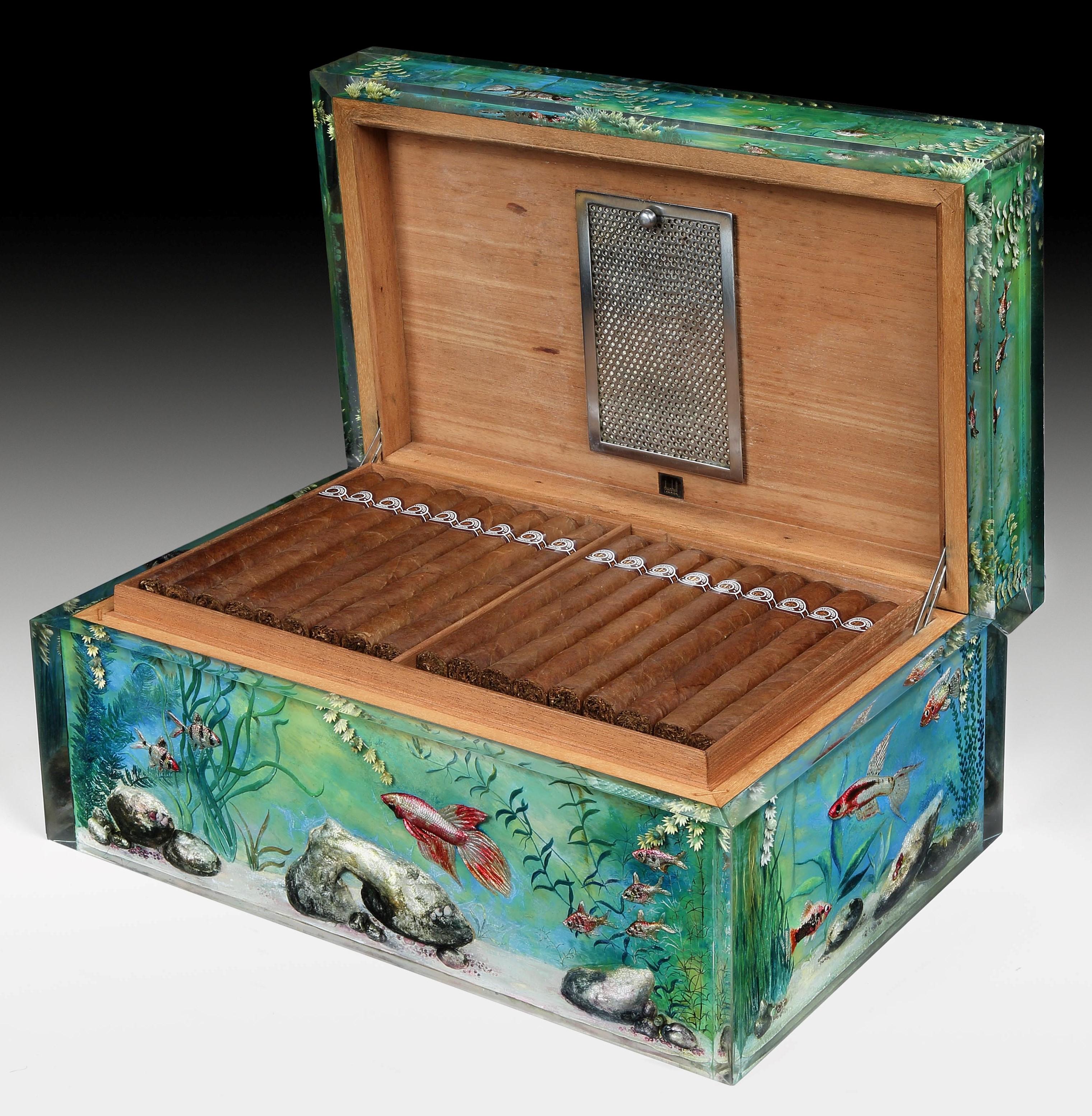 Alfred Dunhill, London

Of superlative quality and scale, this Aquarium humidor is the first of its kind that we have owned or indeed seen. A beautifully painted special-order collaboration between Ben Shillingford, the craftsman behind the