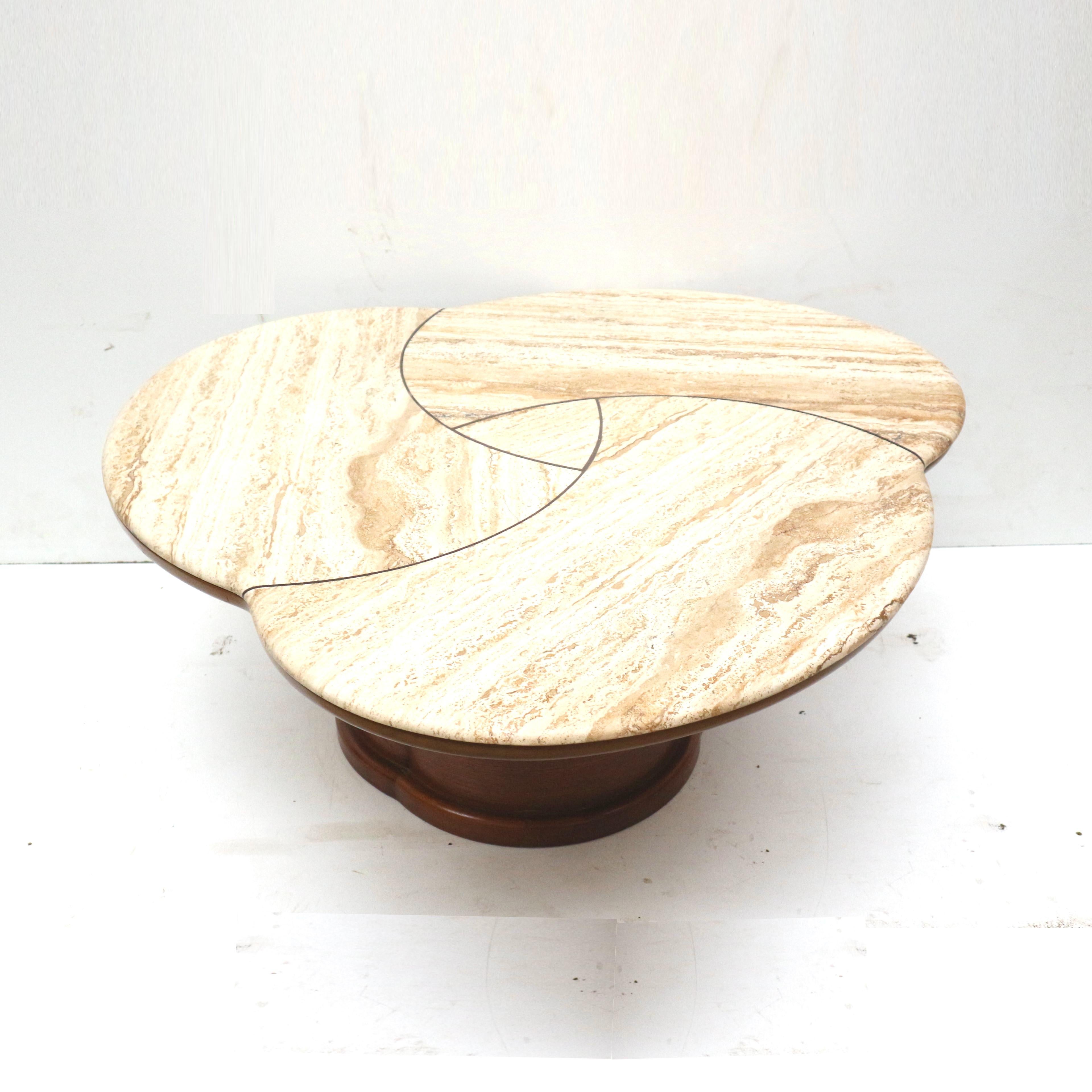 Very rare large coffee table from the 1950s in the style of Jean Royère.

The organically shaped top is made of travertine. The foot is beautifully organically shaped.

Dimensions:
Width: 120 cm
Depth: 113 cm
Height 52 cm

The table has traces of