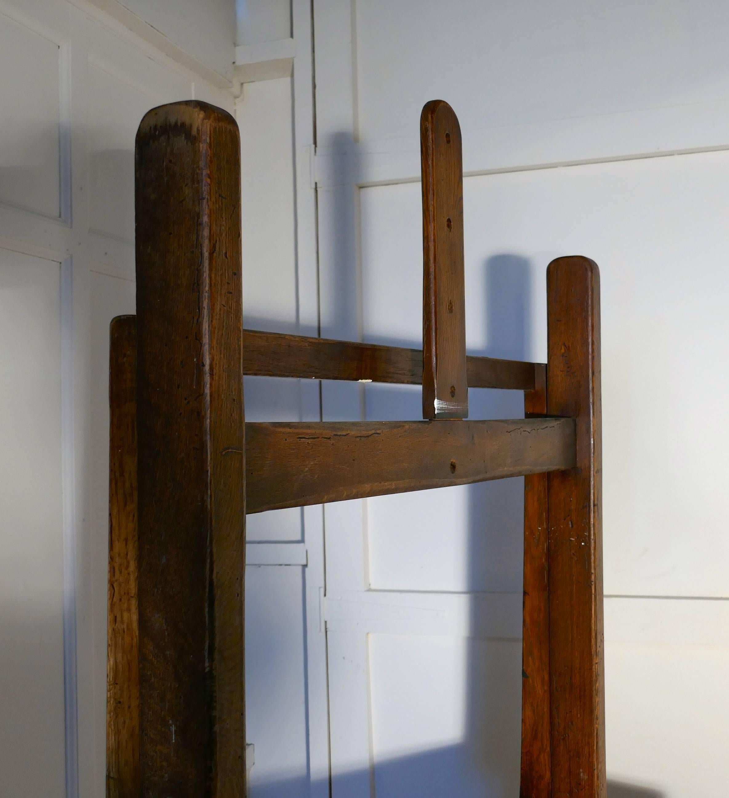 A very rare large French oak studio easel

This a heavy piece and larger than most has an H shaped design, the picture stand is in the form of a wooden frame and can be raised and lowered and held in the chosen position with a wooden peg at the