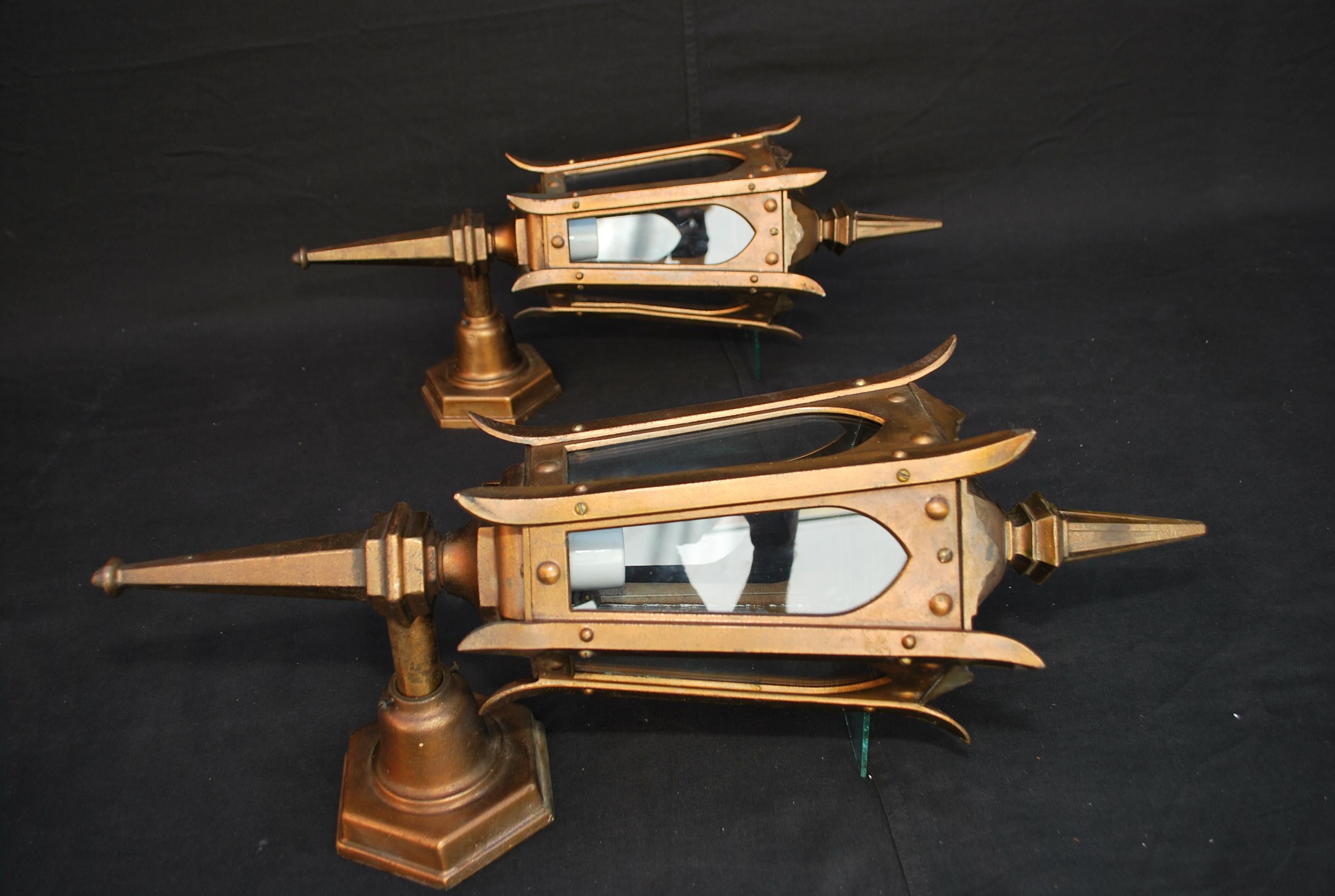 A beautiful and rare large pair of 1920s outdoor bronze sconces, they are quite heavy, made of solid bronze, I come across these rare sconces once every ten years, If I did not have already beautiful sconces at my house, for sure I would have kept