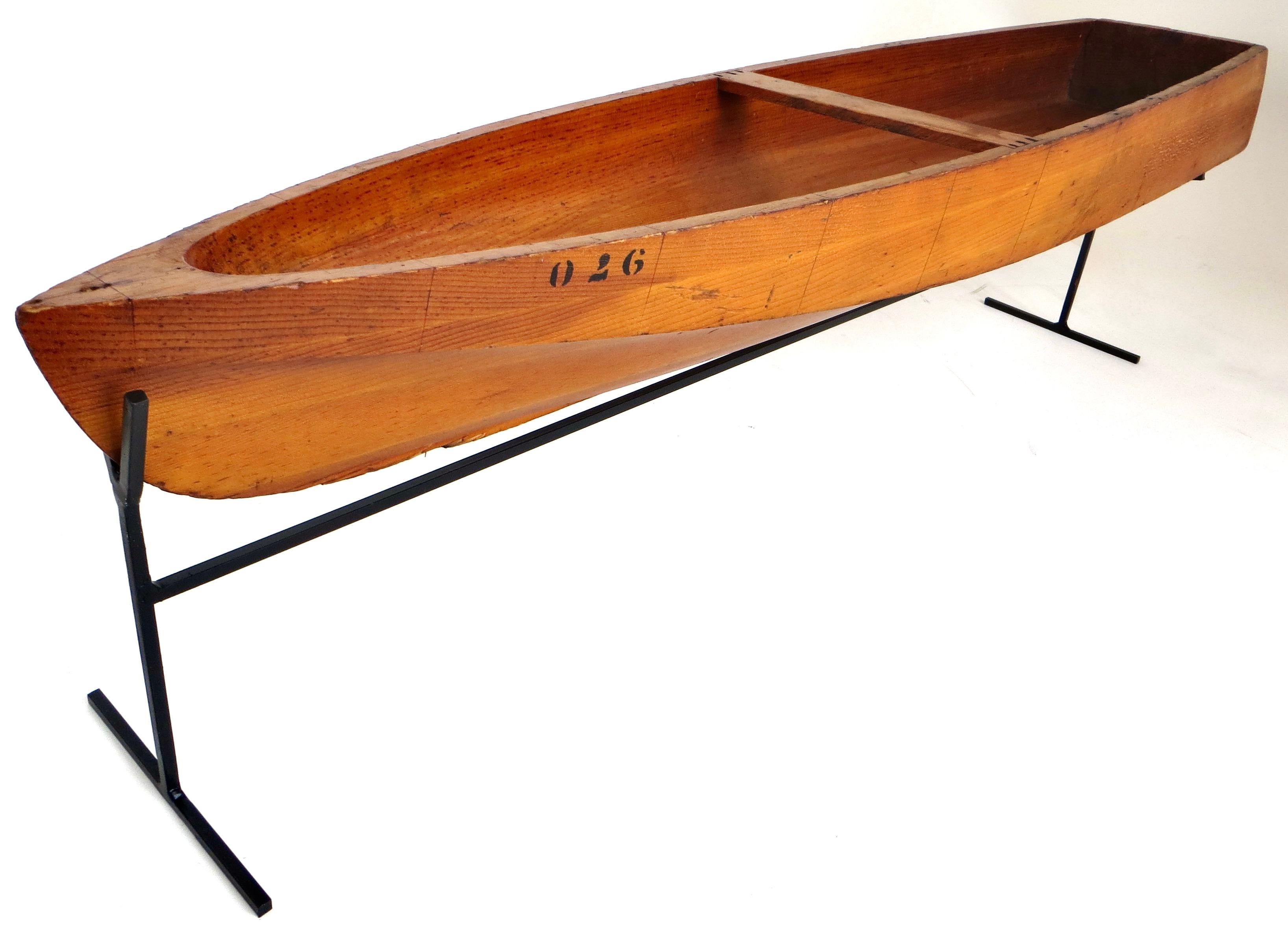 Very rare large size salesman sample skiff boat, circa 1865; hand carved out of a single piece of wood (perhaps maple) with Victorian period black print stenciling to the side in increments of 