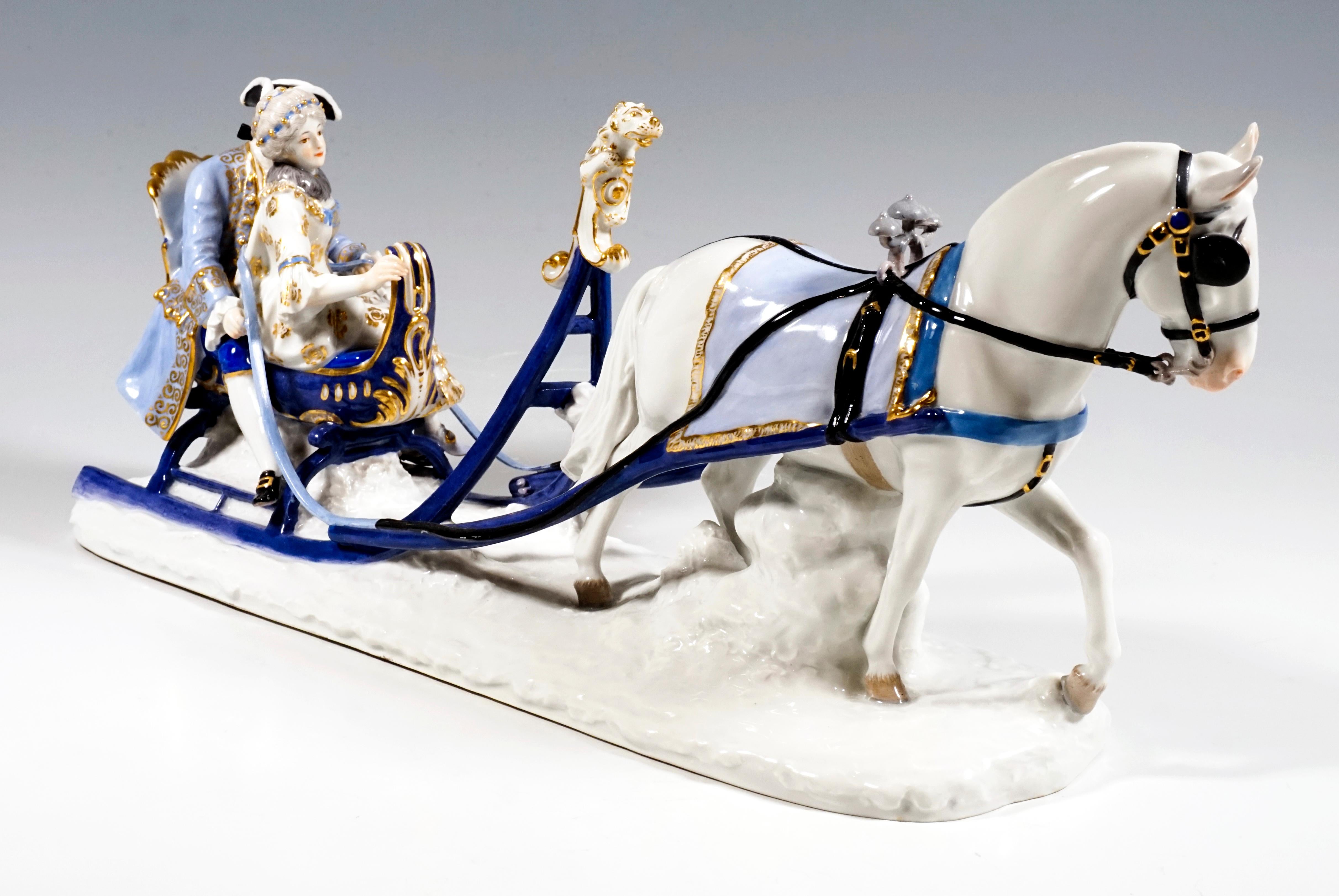 Very seldom executed Meissen figurine group.
On an elongated snow plinth, a gallant couple is pulled on a blue sleigh by a noble, white horse with a blue, gold-framed blanket, blinkers and bells. The sleigh is equipped with white, gold-raised