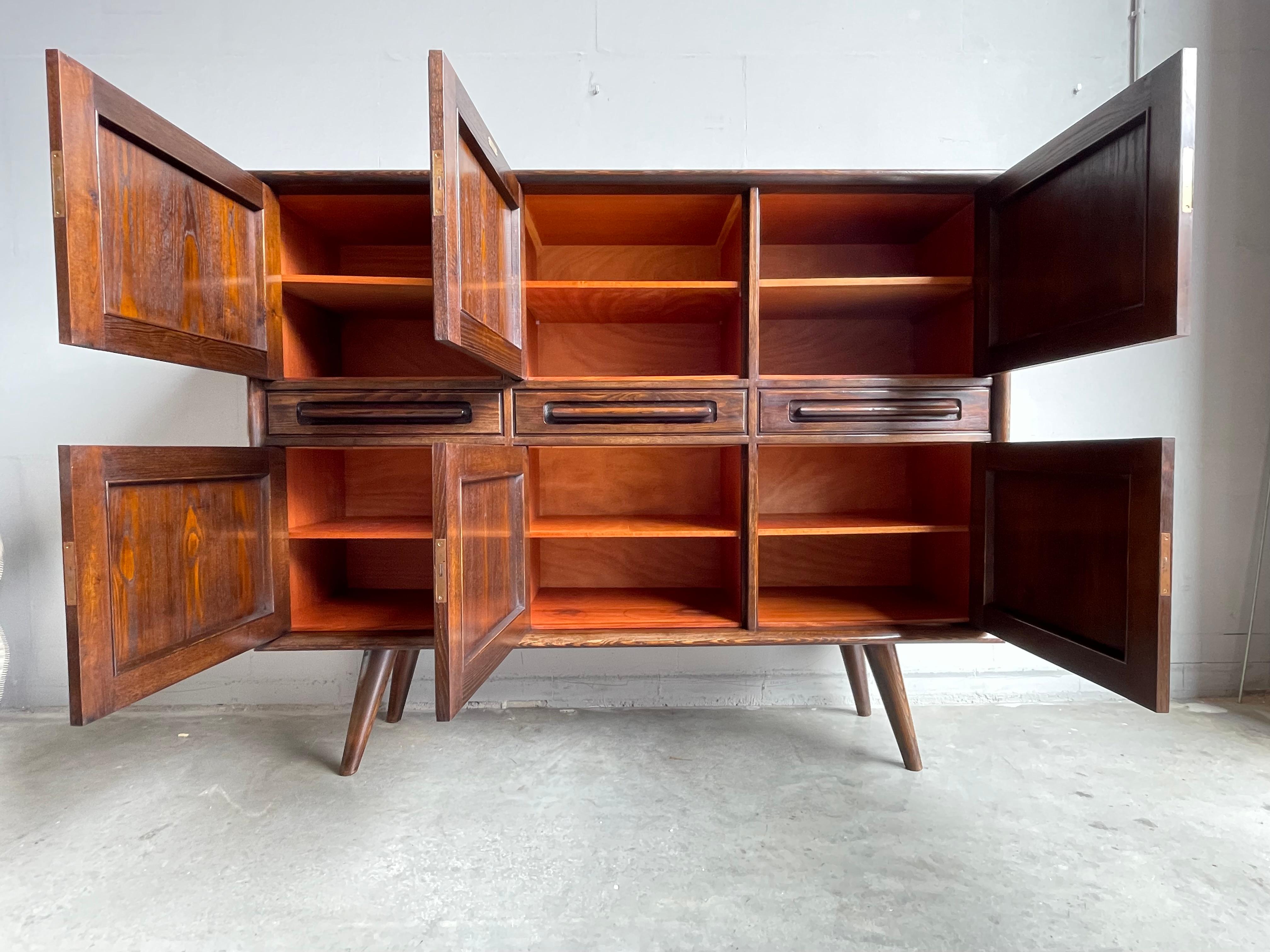 Rare Mid-Century Modern, oak and cherry wood, six doors and three drawers cabinet.

This rare credenza / sideboard by one of Holland's finest furniture makers of the early 1900s could very well be one of the first Midcentury Modern pieces that was