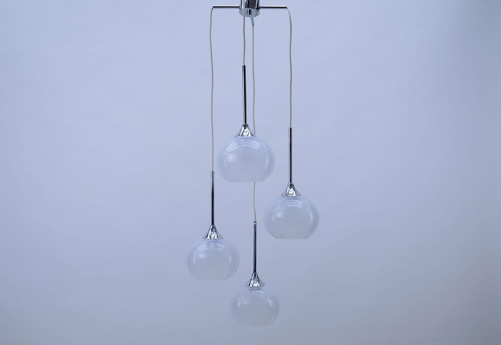 This ceiling lamp features a small frame with 4 cascading milk glass elements with E27 bulb sockets.

Fully functional.

Four E14 sockets. Works with 220V and 110V.

Wiring is suitable for all countries.