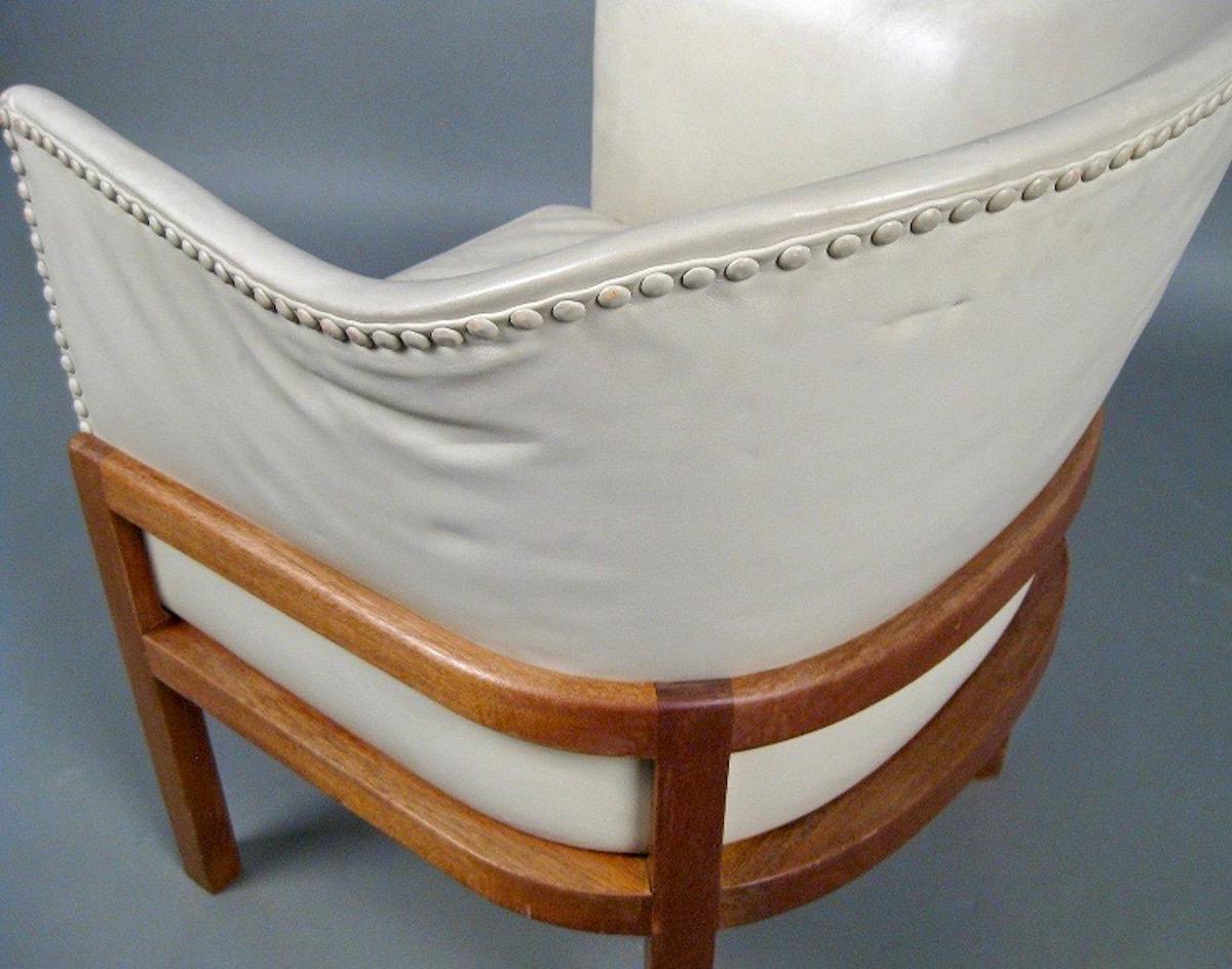 All original with ivory colored leather and mahogany base. Made circa 1970 by Ivan Schlechter. Designed 1940.