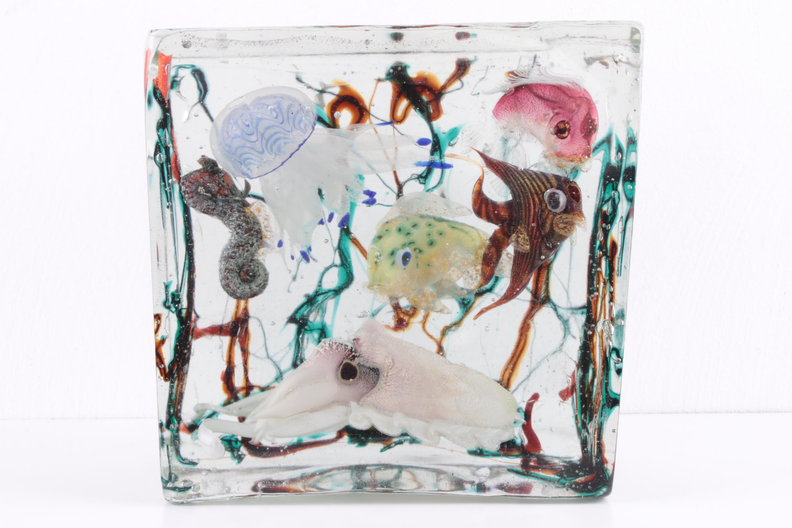 Murano Glass Aquarium by Alfredo Barbini for Cenedese, 1960s

Rare Piece by Alfredo Barbini Murano
art glass aquarium with
three fish,
squid, sea cat
jellyfish
and seahorses in an aquatic scene.

This is a very rare piece of glass art made in the