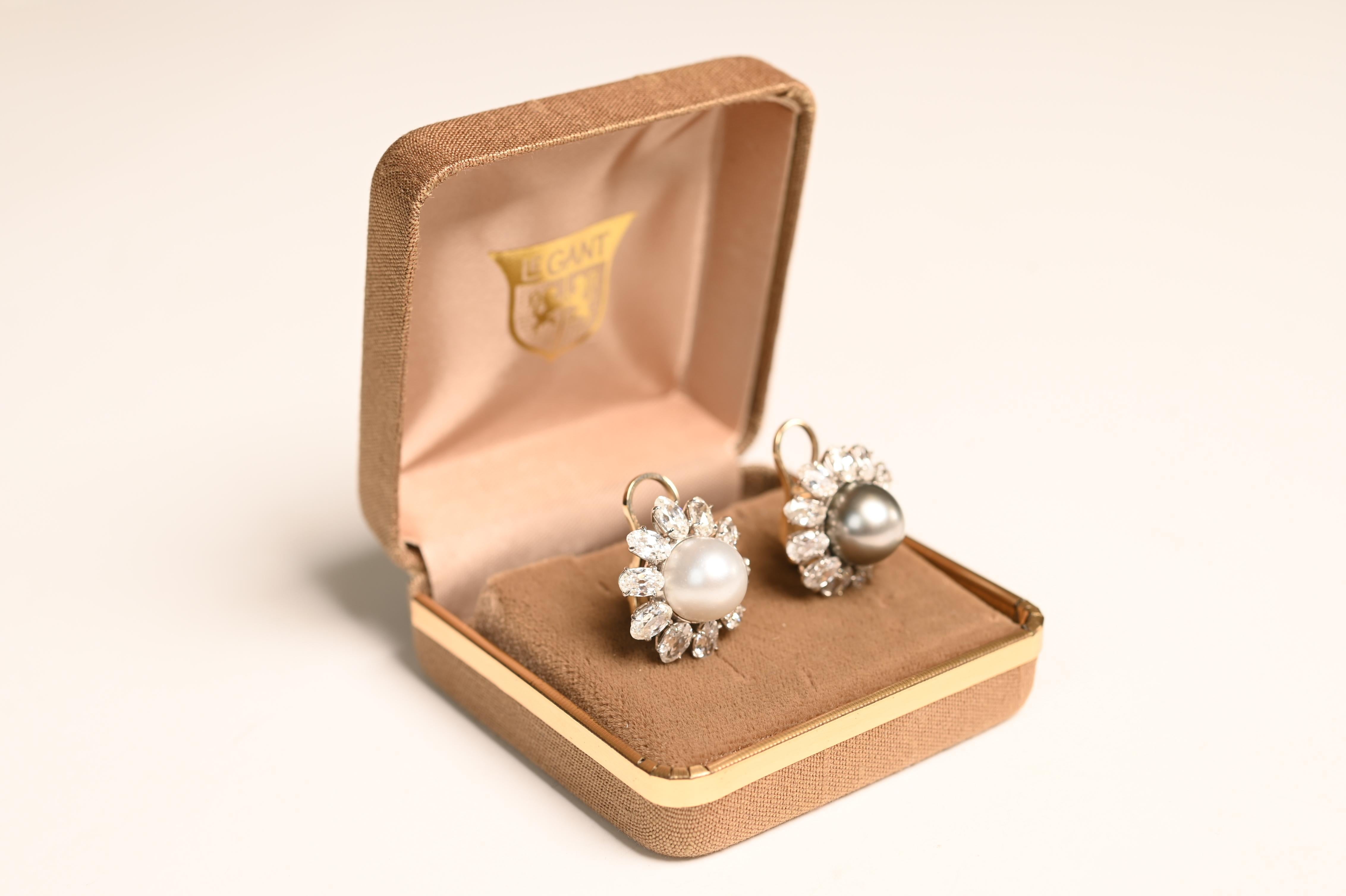 This exquisite pair of earrings showcases two round brilliant-cut diamonds, each securely set in a timeless bezel setting. Together, the diamonds have a total weight of approx 1.8-carats, exhibiting a beautiful H color and I1 clarity. Their radiant