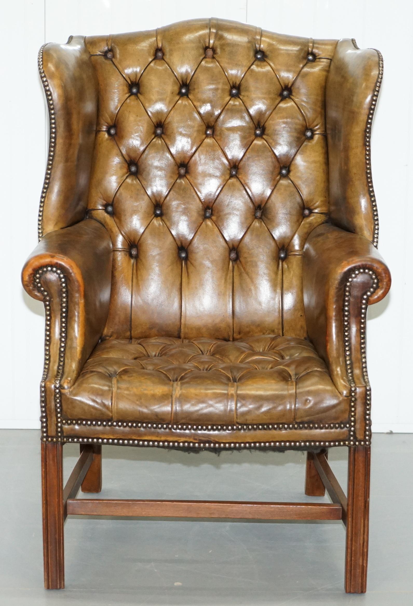We are delighted to offer for sale this lovely original 1930’s Chesterfield aged leather fully buttoned wingback armchair with Georgian style H-Frame

I have a similar cushioned base version of this chair listed under my other items, together they