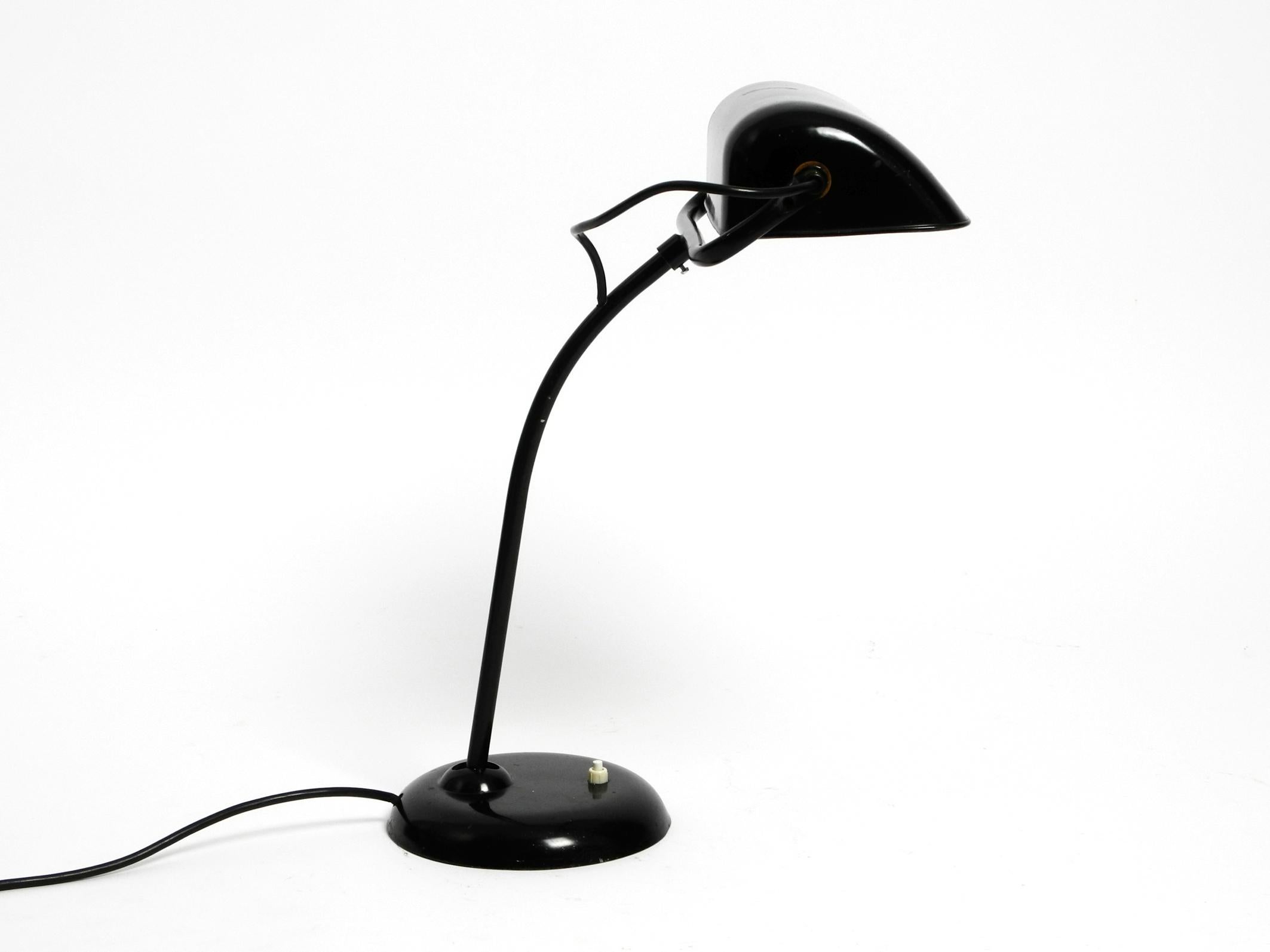 Very rare original 1940s Kaiser Idell industrial metal table lamp model 6581 in black.
100% original condition and fully functional. With original paint.
The rare model with the wide lampshade.
Great industrial design in very good vintage condition