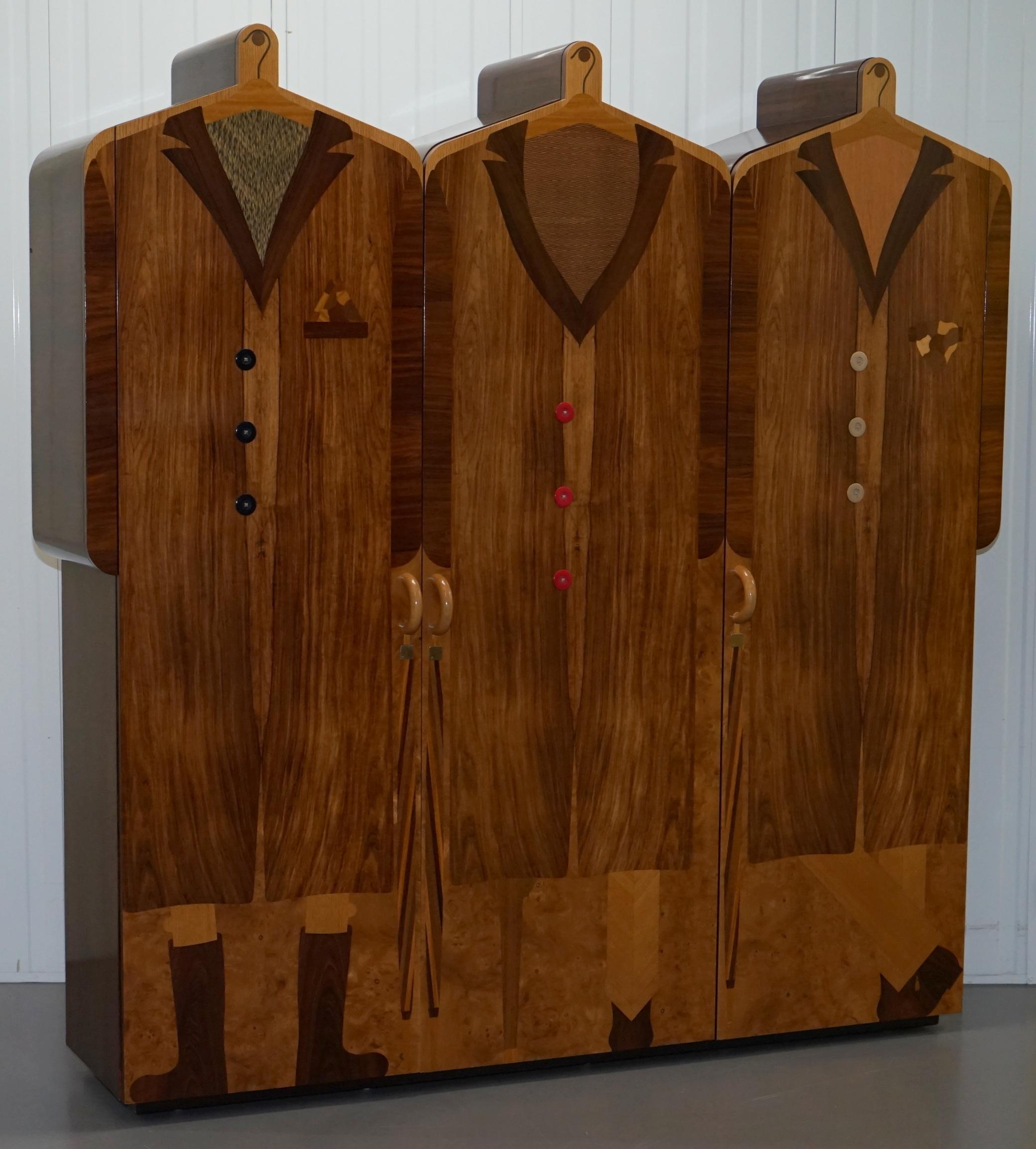 We are delighted to offer for sale this absolutely stunning original Signed and dated Andrew Varah 1989 Umbrella Men Rosewood wardrobe

This piece is pretty, the coolest piece of Art furniture I have ever seen, the pictures don’t come close to