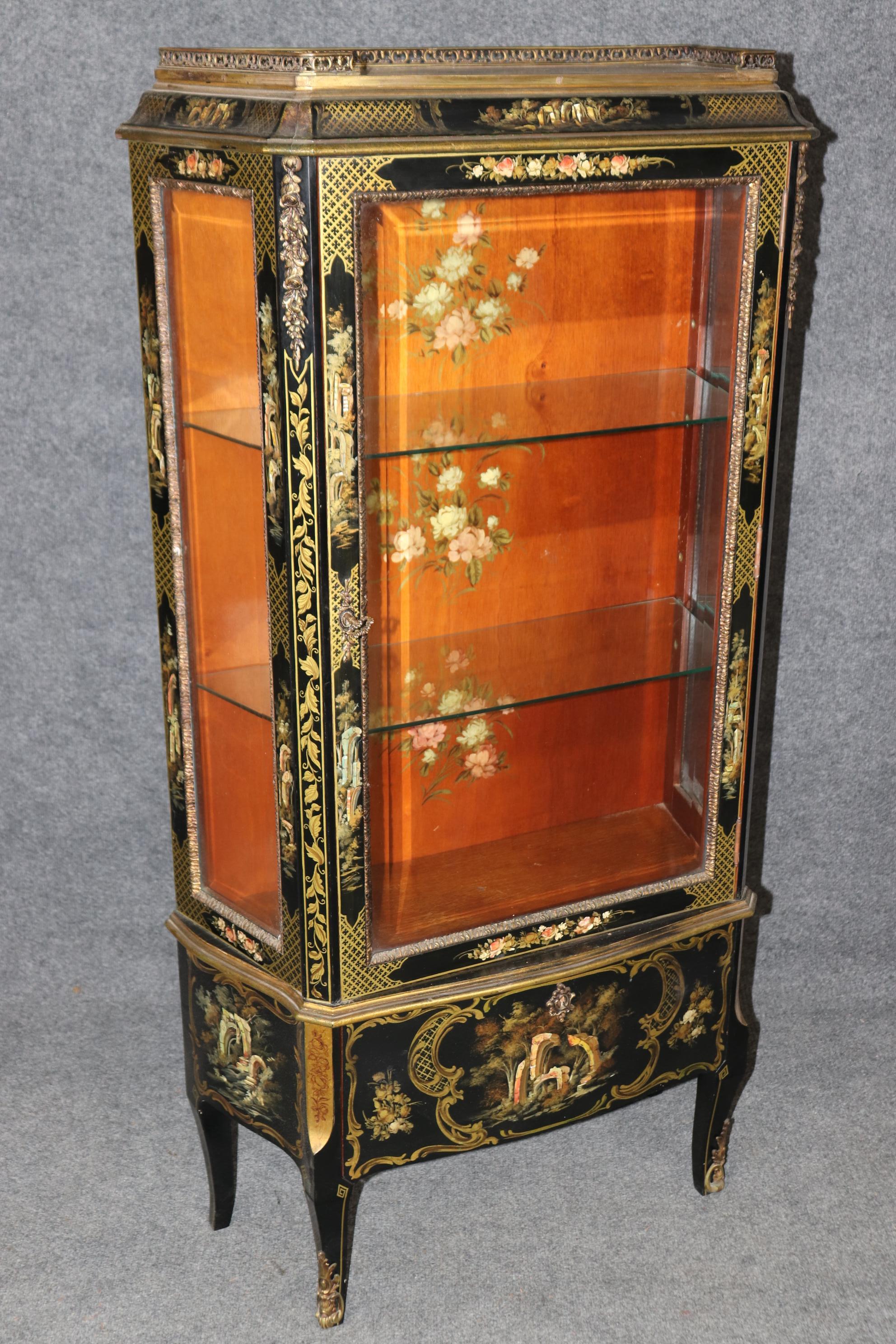 This is a extremely rare pair of black and gold vitrines with hand-painted details, even including the inside of the back and the top. The bronze is of the finest quality and it looks like Sormani or perhaps Lacroix of France but aren't lebeled. The