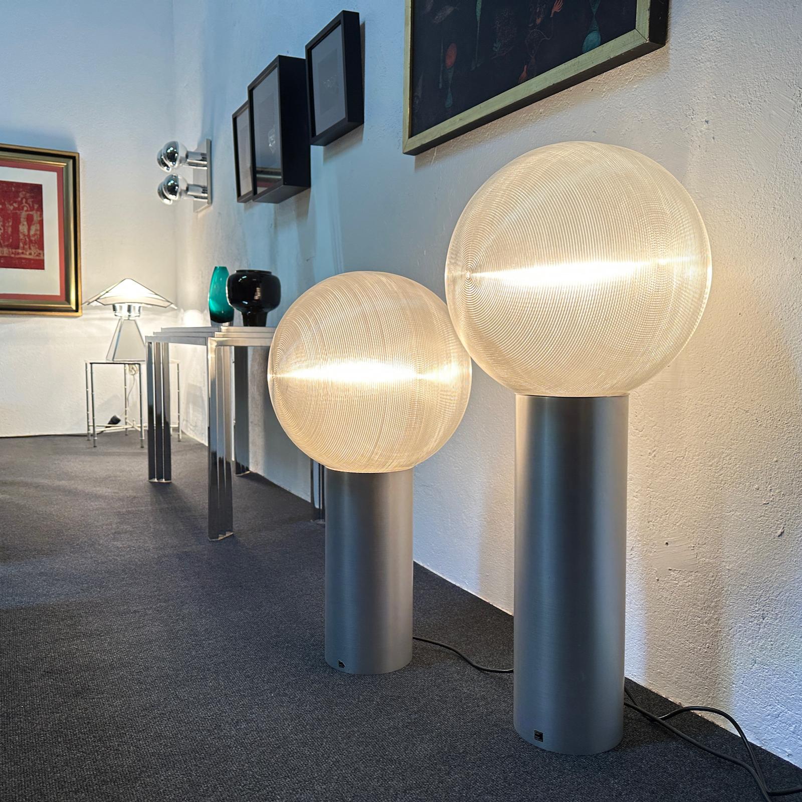 Very rare floor or table lamps by Hilde Roth for Euro Form Studio, Germany 1960s. 
Made of an aluminium stand and ribbed transparent plastic. 
The globe was double-laid out of fine plastic so that a very special light is created. 

Work with a Bulb