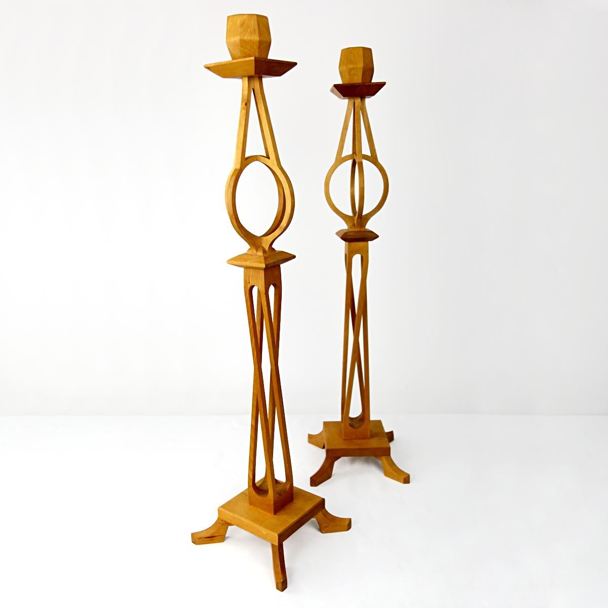 Elegant pair of candlesticks with an interesting Escher-esque design of intertwining wood. With their height of 82 cm / 32.3 inch these are real statement pieces.
The candlesticks are marked 
