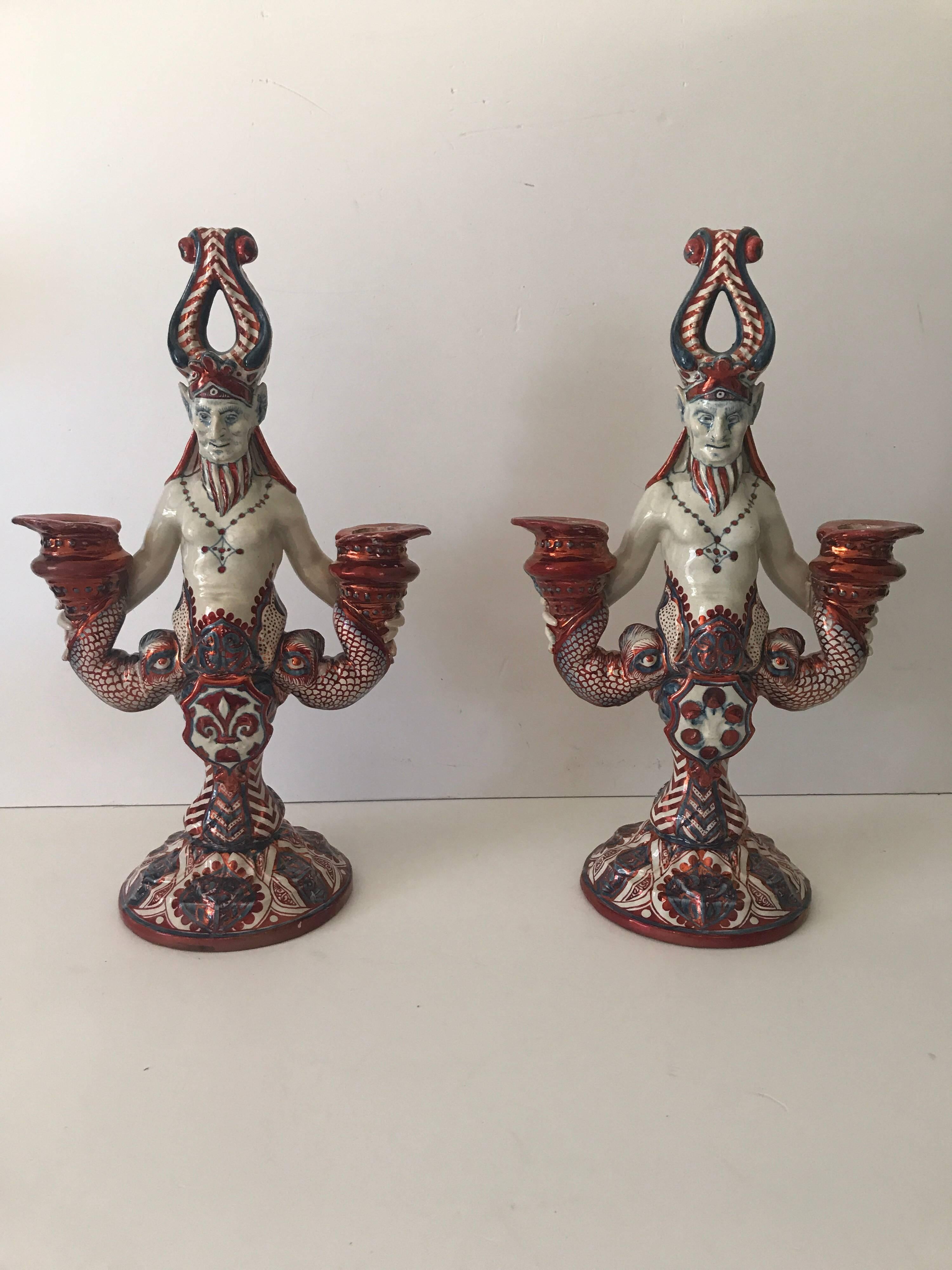 Very rare pair Italian 19th century Cantagalli earthenware demon candelabras.
A nice similar pair of rare and special demon candelabras, they are not 100% similar, they differ from the shield in the centre. But otherwise they are the same. The
