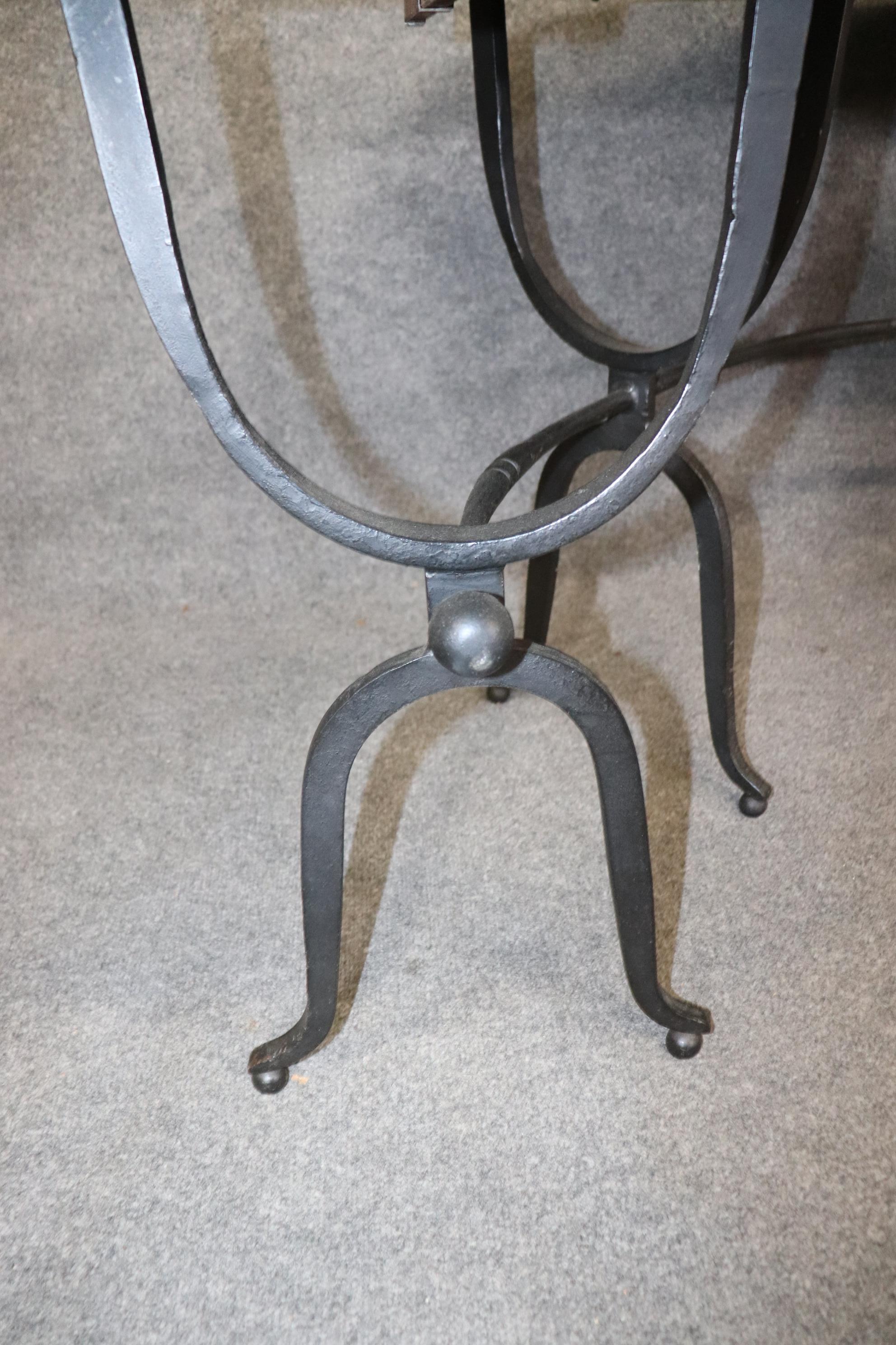 This is a great hand-wrought iron and pine serving table, often used for wine serving and it can also be used as a writing desk. The table measures 28 tall x 62.5 x 45.5 deep when the flaps are up and 33.25 deep when the flaps are down. The piece
