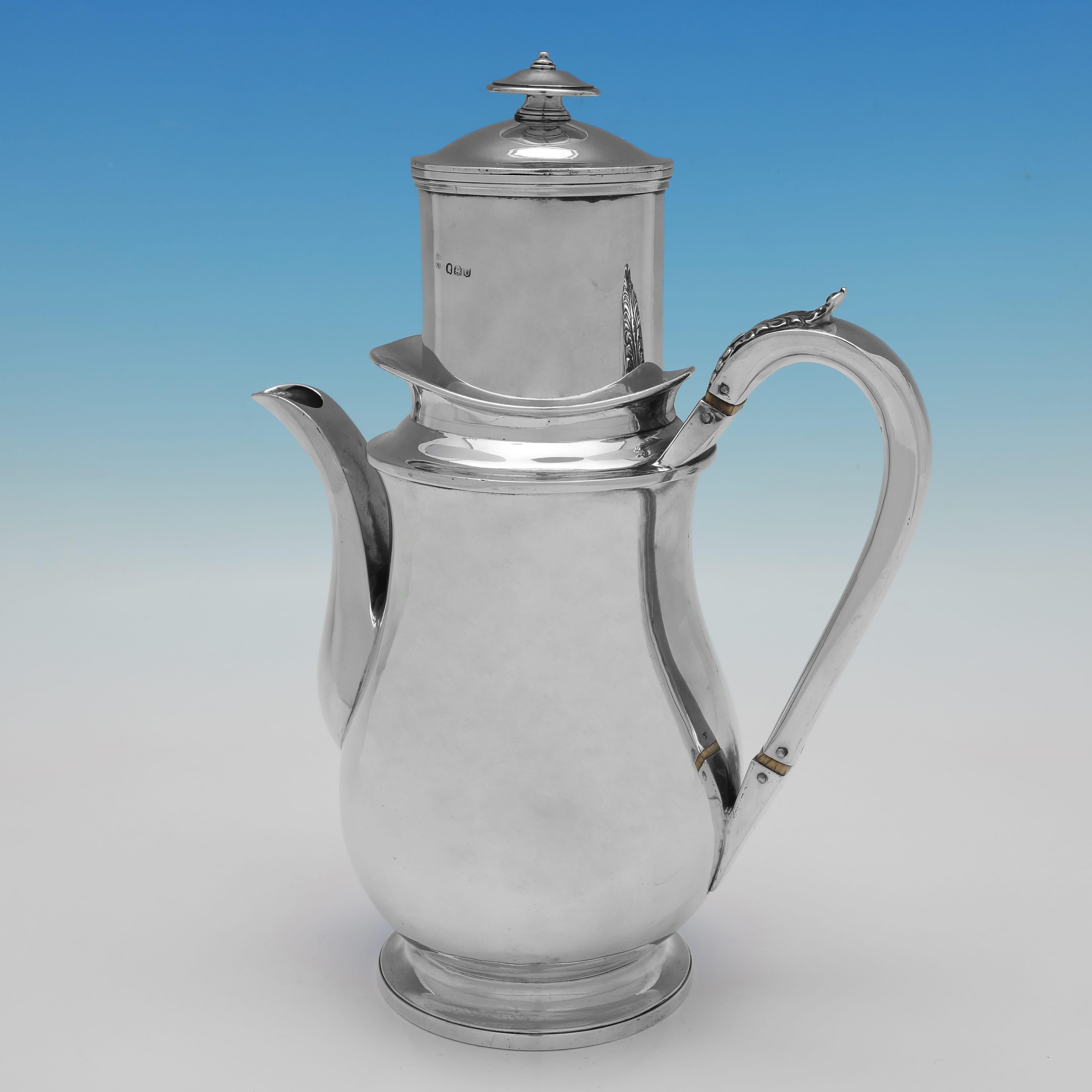 Hallmarked in London in 1815 by Emes & Barnard, this handsome, Regency Period, Antique Sterling Silver Cafetière or French Press, is plain in design, and carries a crest on each piece. 
The cafetière measures 11