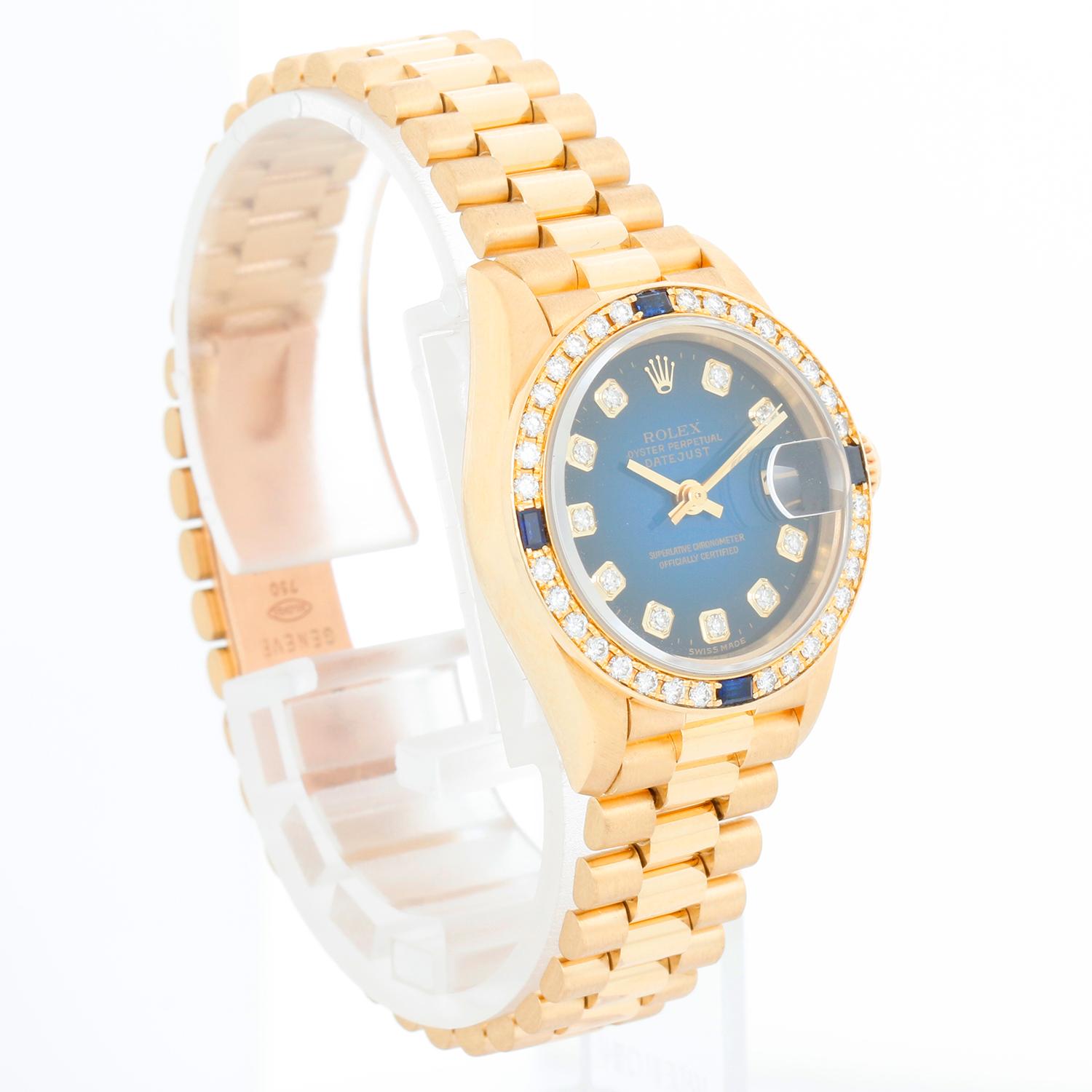 Very Rare Rolex Ladies President 18K Yellow Gold 69088 Watch - Automatic winding, 29 jewels, Quickset date, sapphire crystal. 18k yellow gold case with diamond and sapphire bezel (26mm diameter). Factory Rolex Blue Vignette Dial. 18k yellow gold