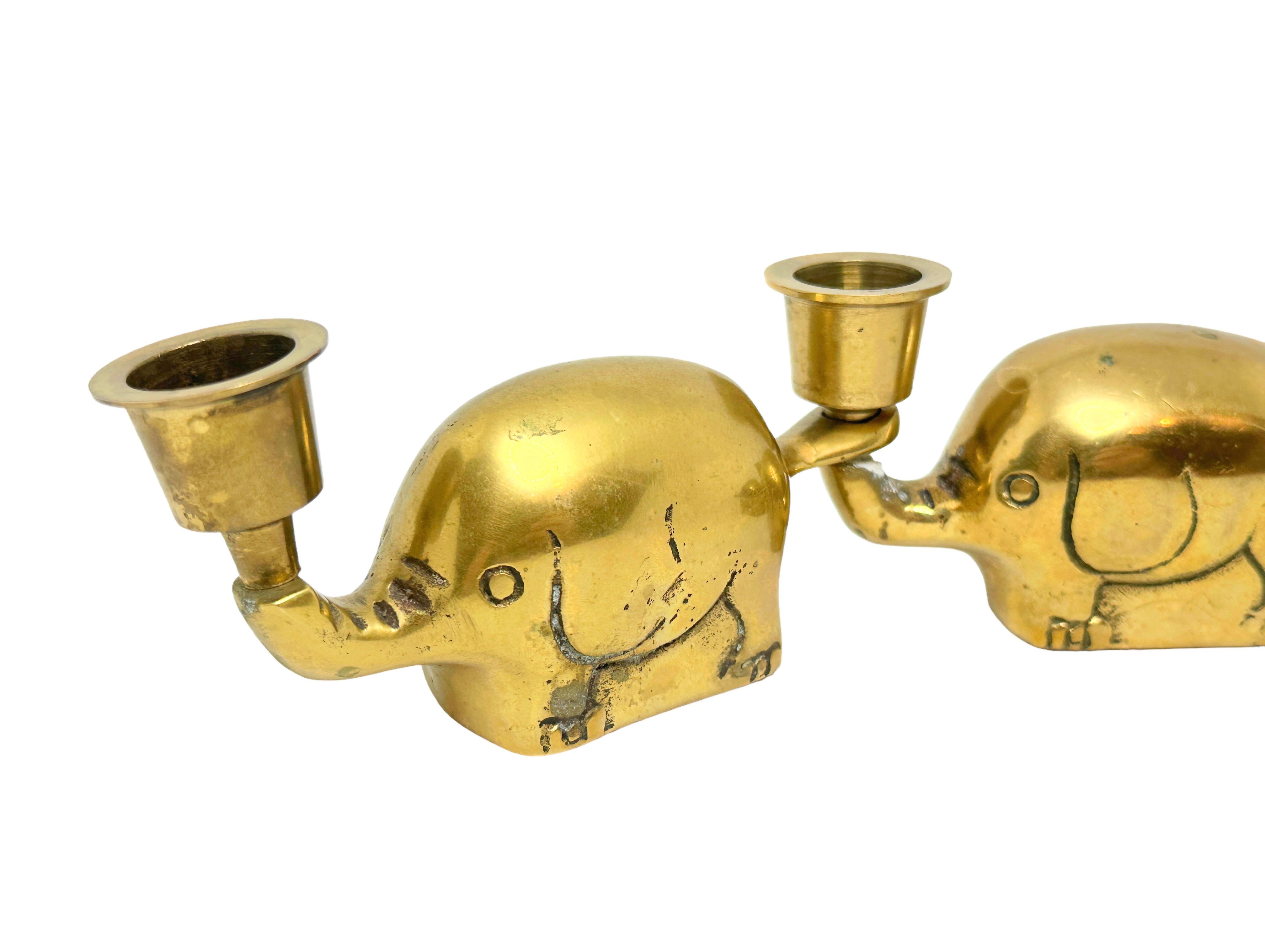 Very rare set of three Art Deco brass candlesticks elephant herd, Germany, 1940s. Can be used as single or in a chain. Each one is approximate 2 3/8