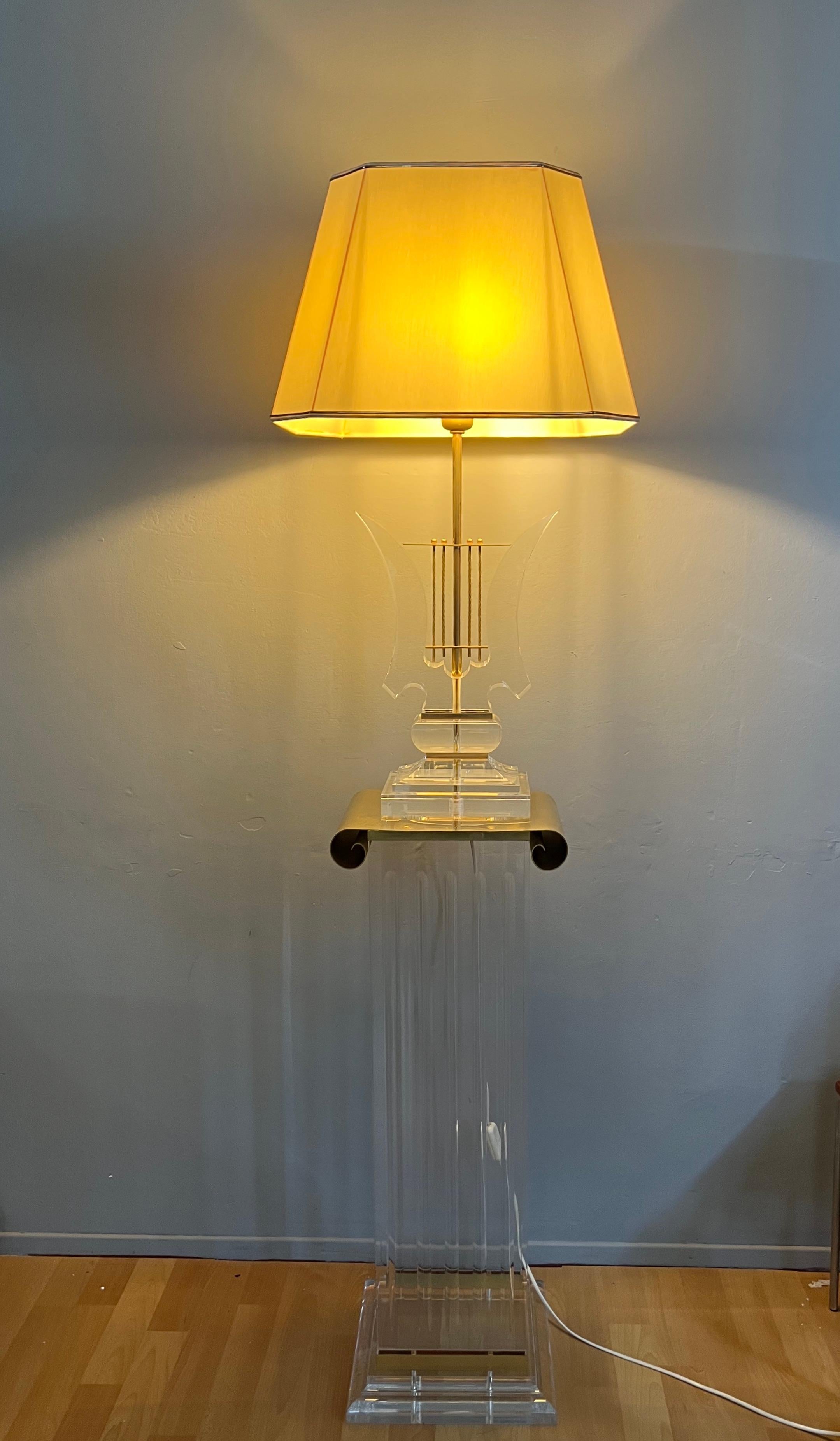 Rare and completely original set creating a Hollywood Regency floor lamp.

This exceptionally beautiful and what we believe to be a very rare set of a midcentury pedestal with a matching, harp design table lamp in the Hollywood Regency style is