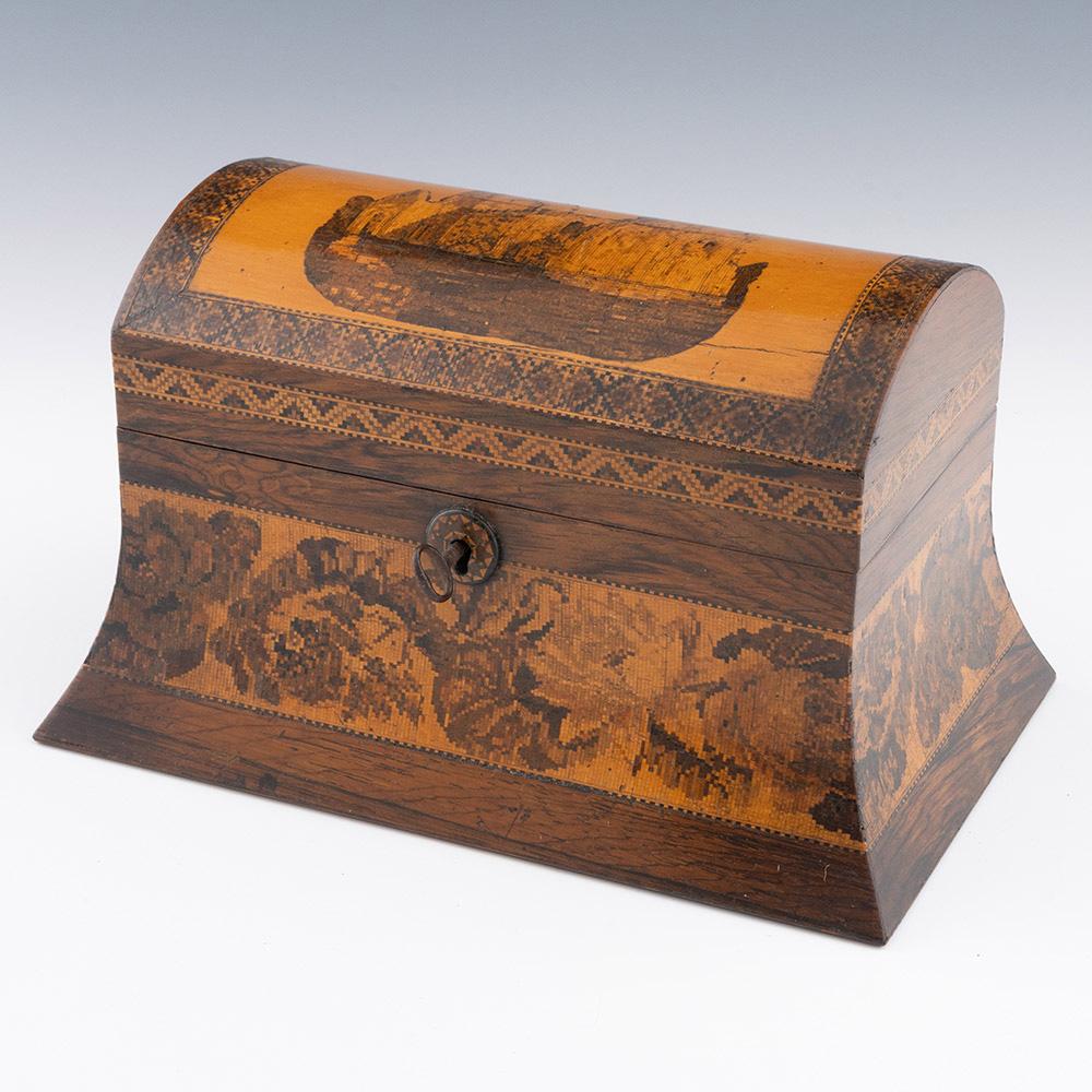 Encabezamiento : Caja de Tunbridge Ware con imagen de la iglesia de Dover y Pharos

Fecha : c1860

Periodo : Victoria

Origen : Probablemente Tunbridge Wells, Kent

Decoración : Mosaico central de la iglesia de Dover y Faros con borde teselado