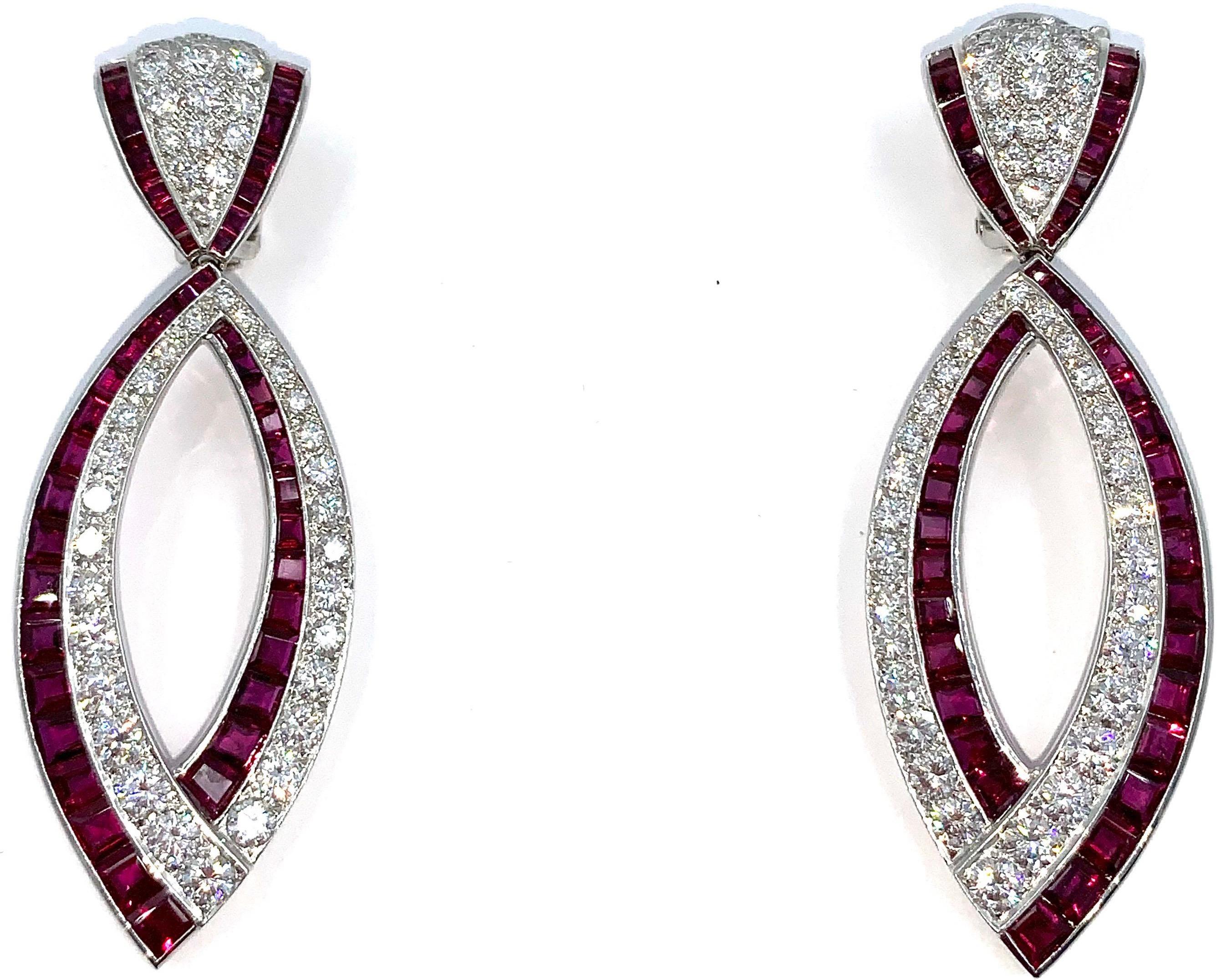  1970's 18 karat white gold ruby and diamond earrings by Van Cleef & Arpels. The stunning earrings are set with approximately 6 carats of fine diamonds and 4 carats of fine rubies. 

Signed with appropriate hallmarks