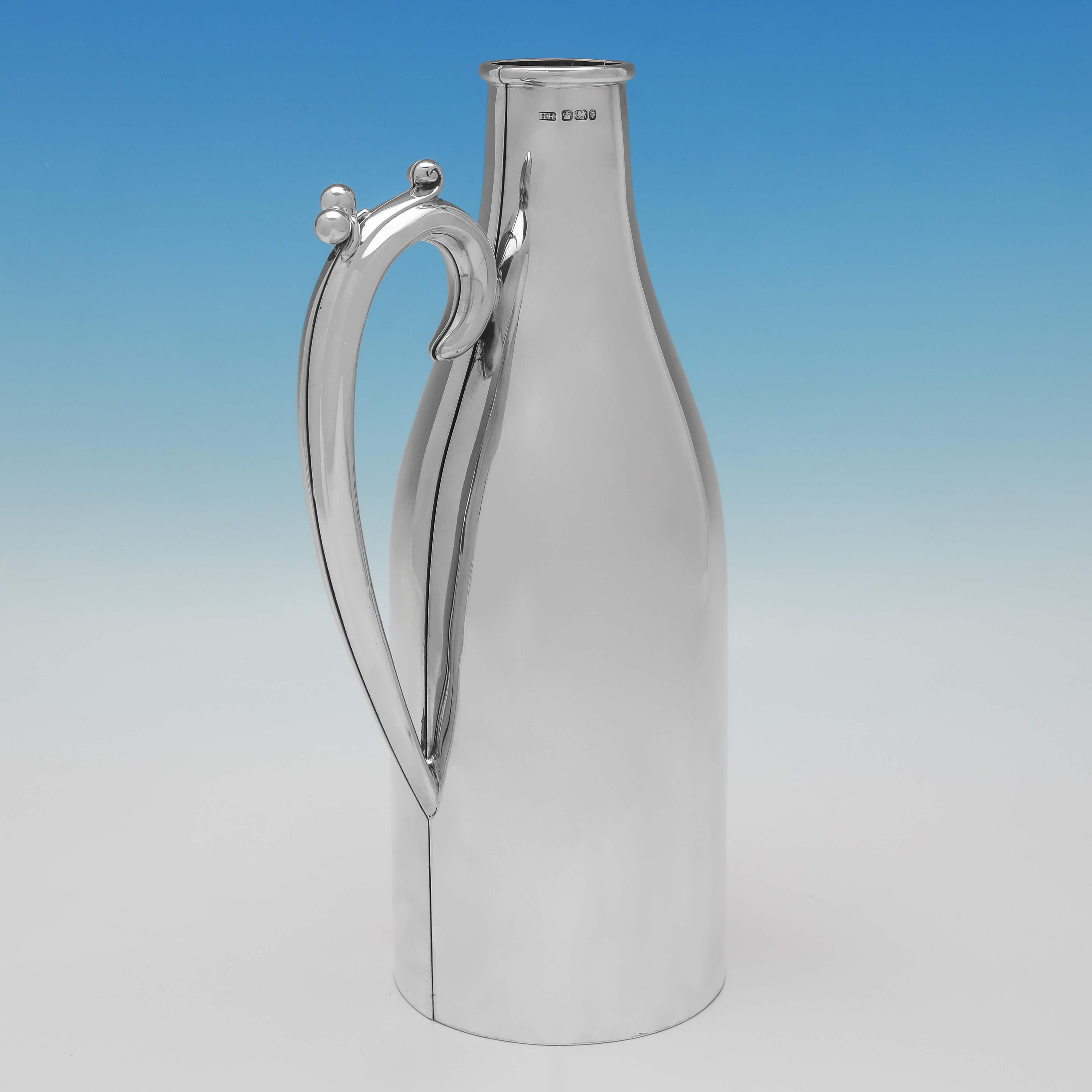 Hallmarked in Sheffield in 1895 by Harrison Brothers & Howson, this handsome, Victorian, Antique sterling silver wine bottle holder, is elegantly simple in design.

It is very rare to find sterling silver examples of wine bottle holders, the