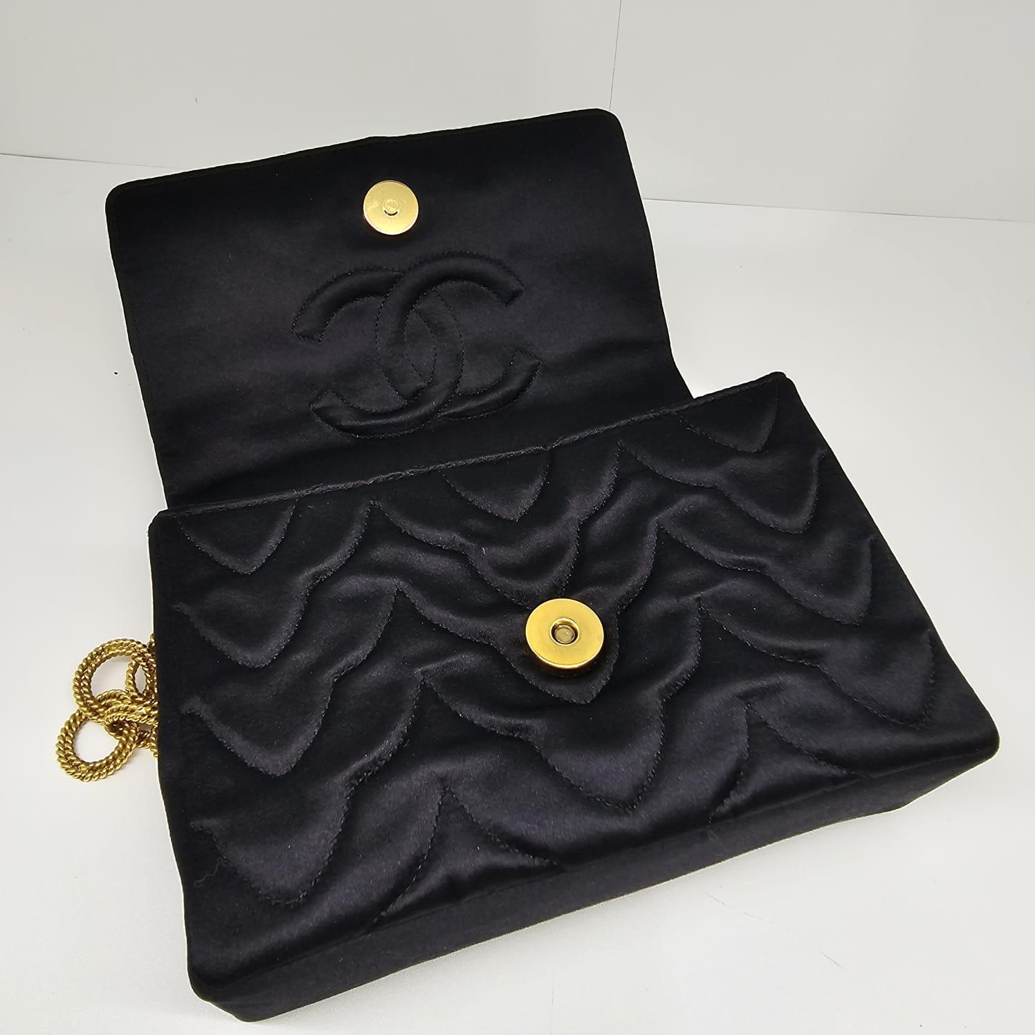 Very rare Chanel mini Gripoix flower satin flap bag. 24K gold plated. Beautiful vintage condition, with very minor marks and scuffs on the bag. Series #1. Comes with its hologram intact, card and box. Very rare collector item.