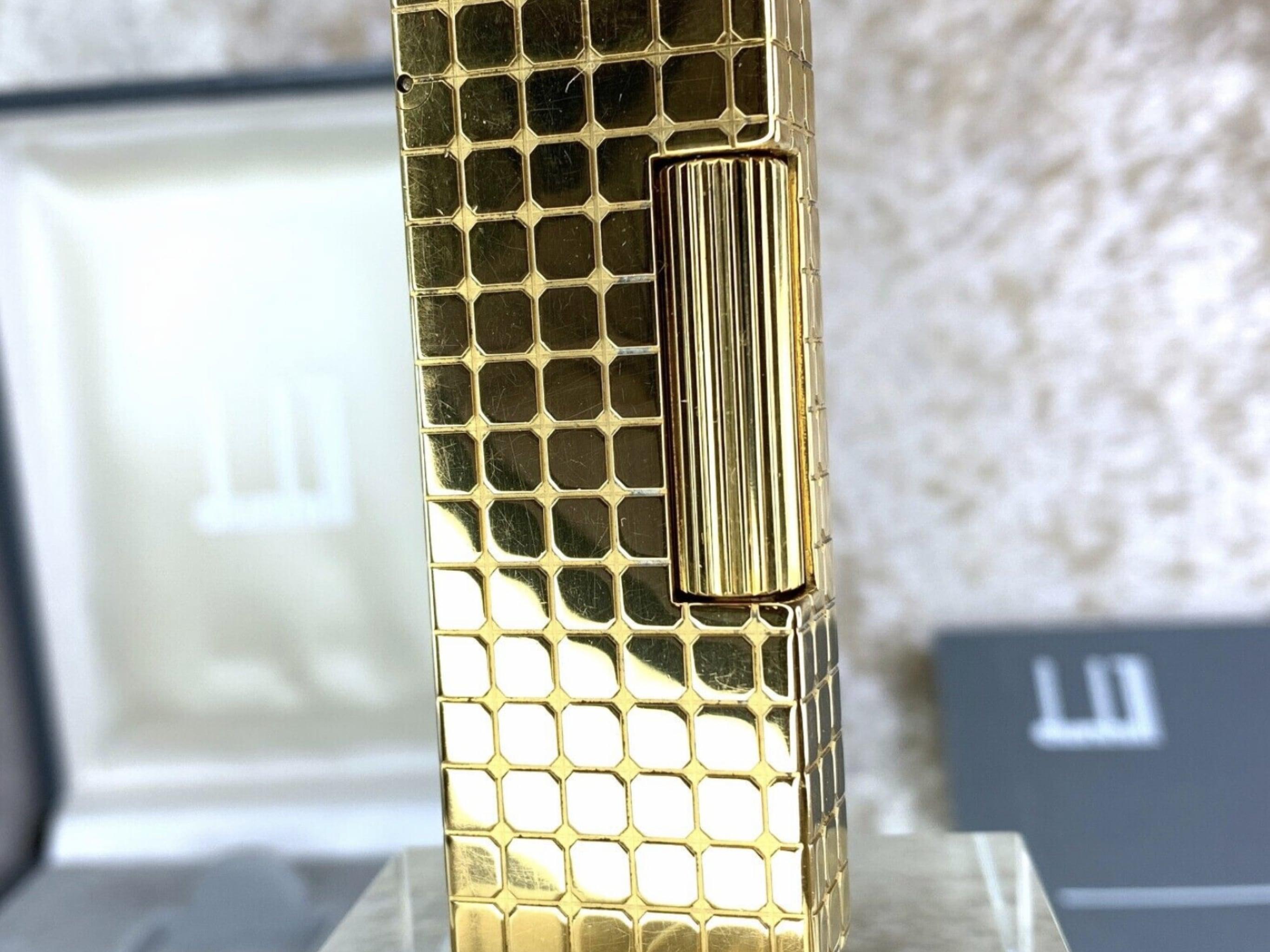 Vintage Dunhill Lighter Rare Gold Plated Block Texture
Very rare 
Circa 1990s
18K Gold plating 
With Original Dunhill Silver box and Case 
Original Dunhill papers 
Lighter sparks, ignites and flames 
In fantastic working condition
As good as new 