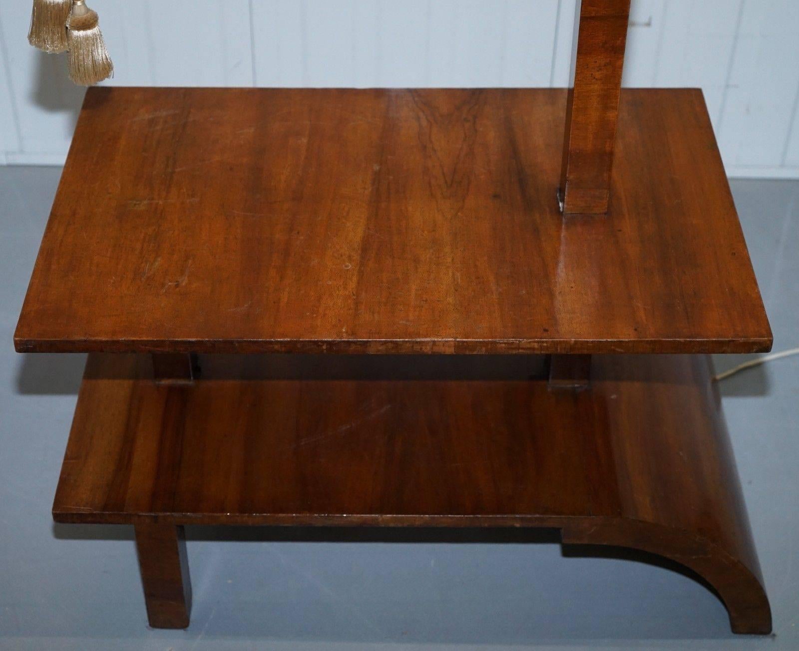 We are delighted to offer for sale this absolutely stunning original Art Deco walnut side table with built in height adjustable lamp

A very rare early Deco piece in lovely lightly restored condition. The height adjustment works as it should, it’s