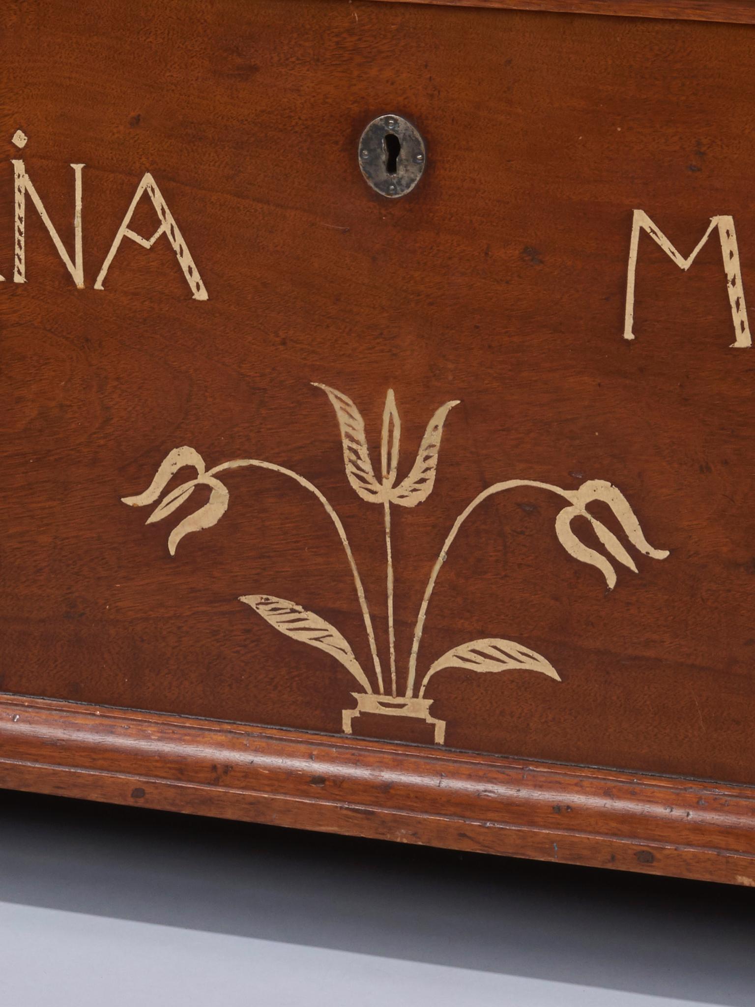 Made for Cadarina Moser, Lancaster, PA in 1801. Inlaid tulips and resting on ogee feet. Iron strap hinges inside. Pictured and mentioned in 