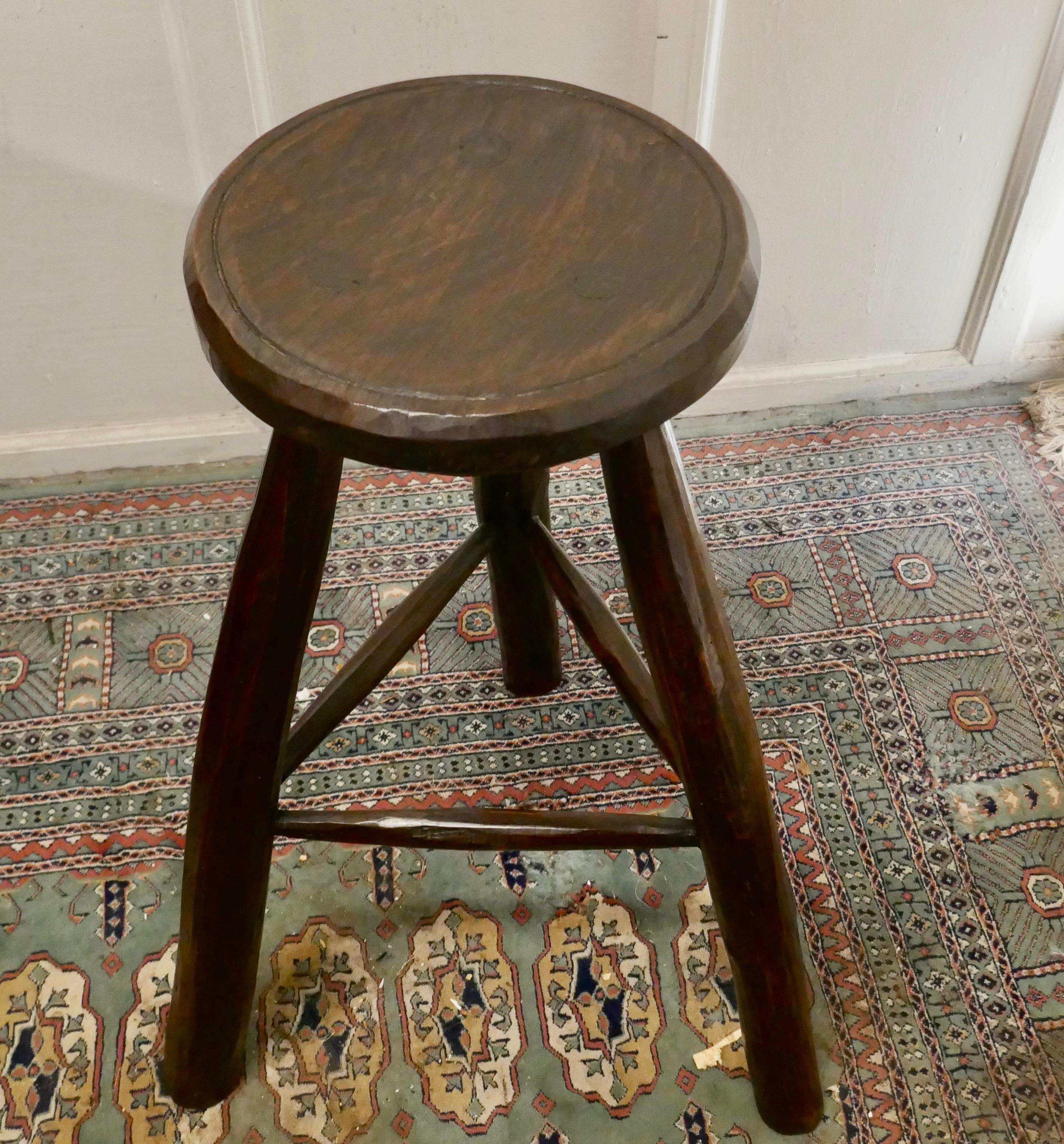 Very Rustic 19th century French High Stool 

This is a long leg stool it is made in ash and elm, the seat is hand carved from one solid piece, each of the 3 legs carved from a single branch and set into the seat
The Stool is a very sturdy piece
