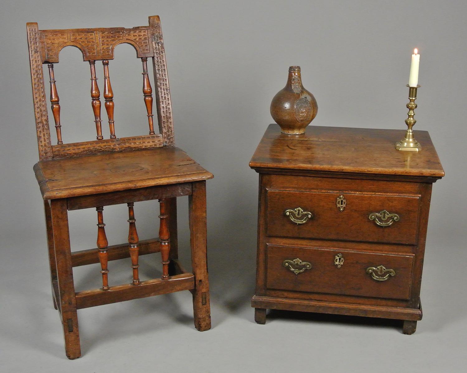 A small oak chest of two drawers, possibly made for a child and of particularly small proportions.   

The oak lined drawers with fine hand cut boards with dovetailed jointed and bright medullary rays.

The drawer fronts overlapping and in solid