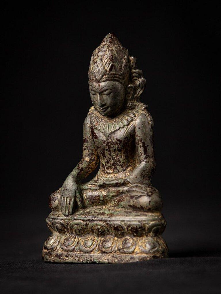 Material: bronze
9 cm high 
5,7 cm wide and 2,6 cm deep
Weight: 0.179 kgs
With traces of the original lacquer & 24 krt. gilding
Bagan style
Bhumisparsha mudra
Originating from Burma
12-13th century
Still in perfect condition !
Very special