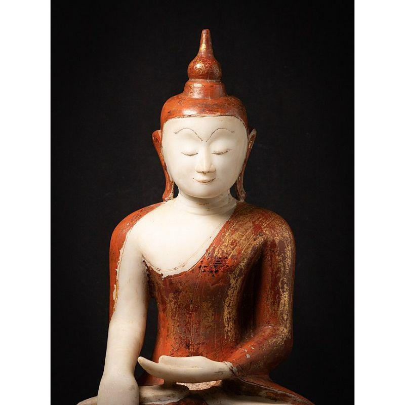 Material: marble
81,5 cm high 
47,5 cm wide and 24 cm deep
Weight: 72.45 kgs
With the original lacquer and 24 krt. gilding
Ava style
Bhumisparsha mudra
Originating from Burma
17th century
Very nice quality and beautiful expression !
Not easy to find