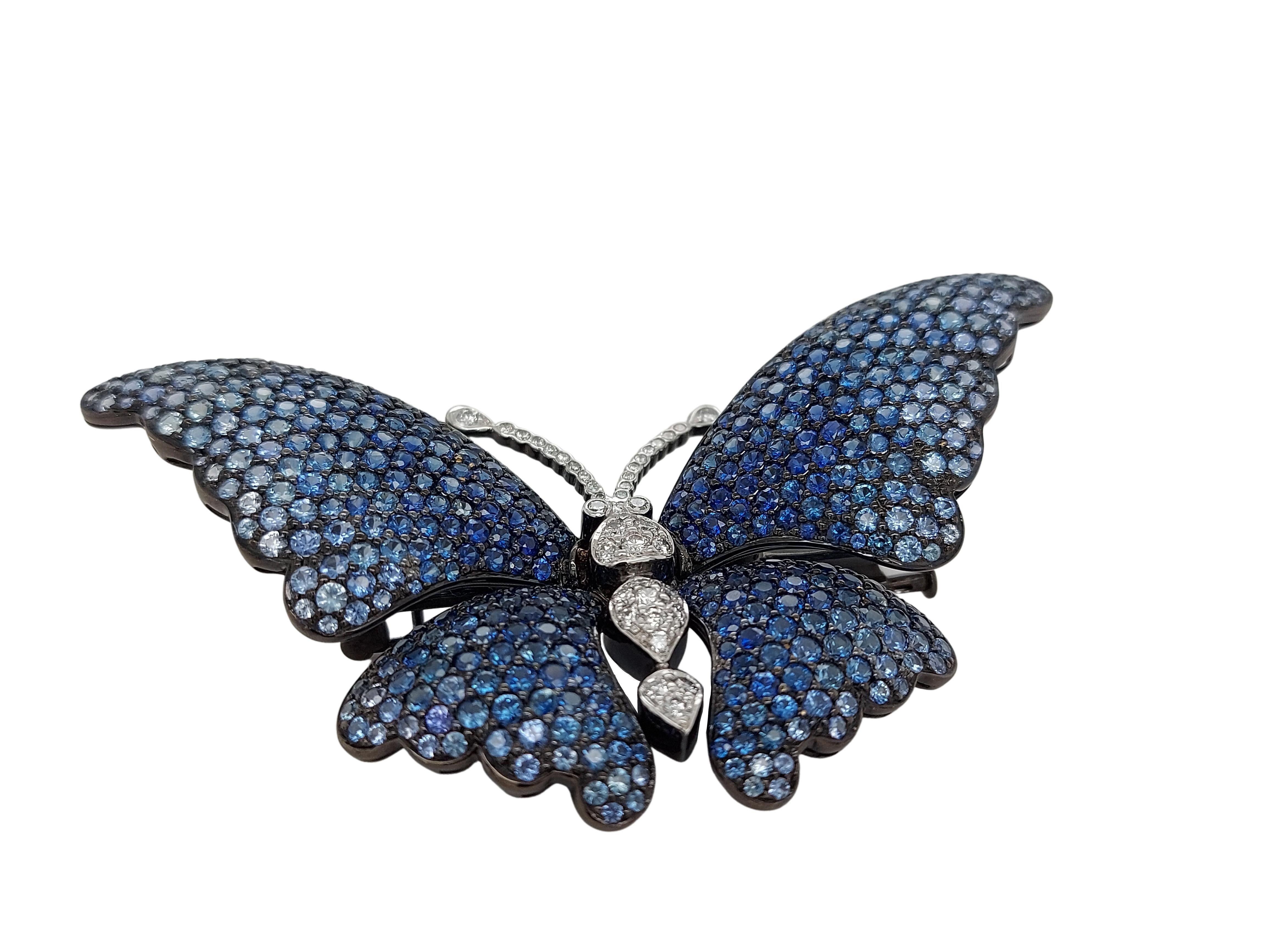 Very Special Butterfly Brooch with 9.55ct Blue Sapphires and 0.62ct Diamonds 

Amazing color shades from light to dark.

One of a kind piece of art by our goldsmith and diamond setter.

Diamonds: brilliant cut diamonds, together 0.62ct

Sapphires:
