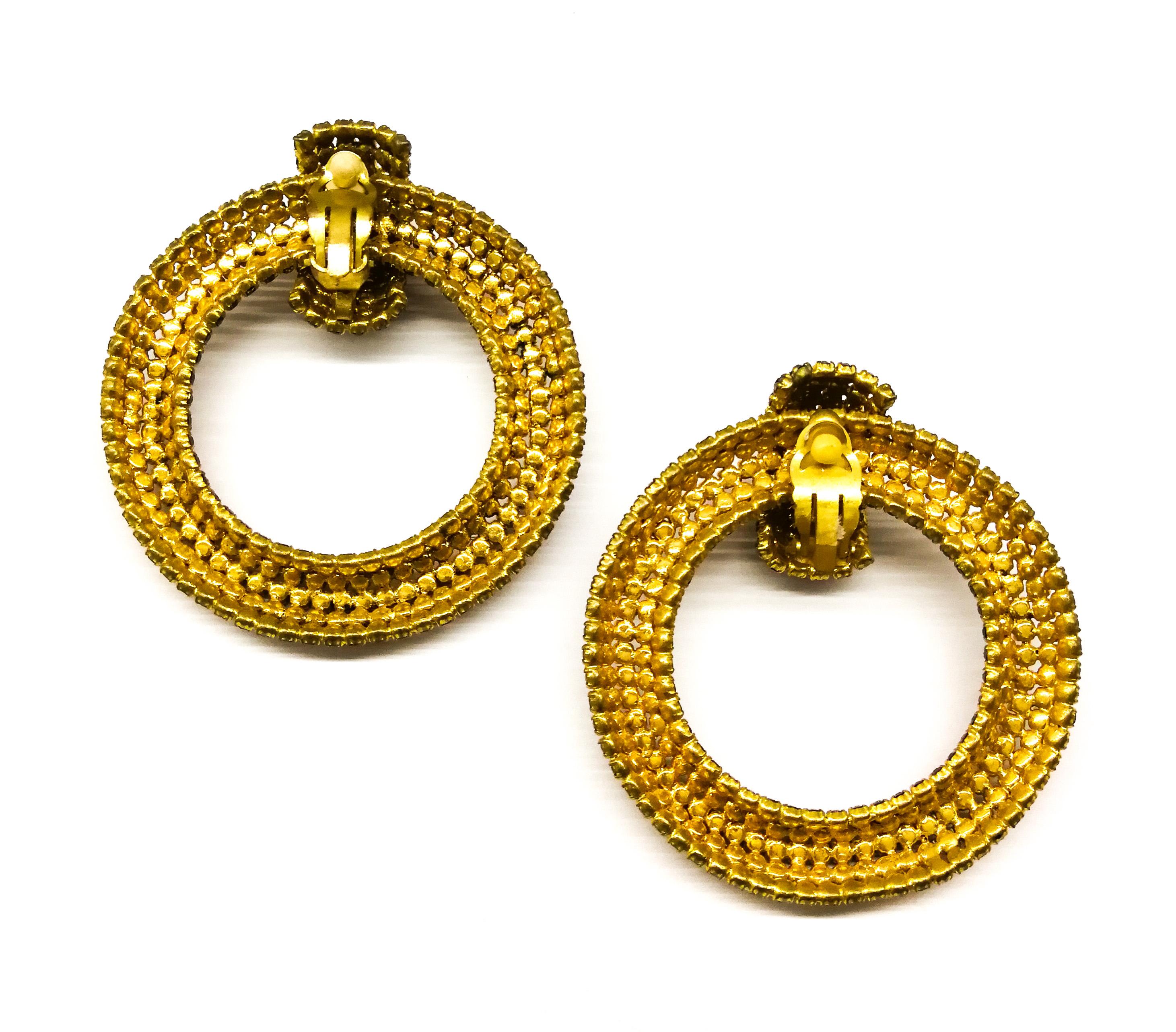 Very stylish and highly typical of Roger Jean - Pierre's haute couture style, these earrings are bedecked with closely set, beautifully warm, golden pastes that light up the face. Highly unusual but typical of the French haute couture of this