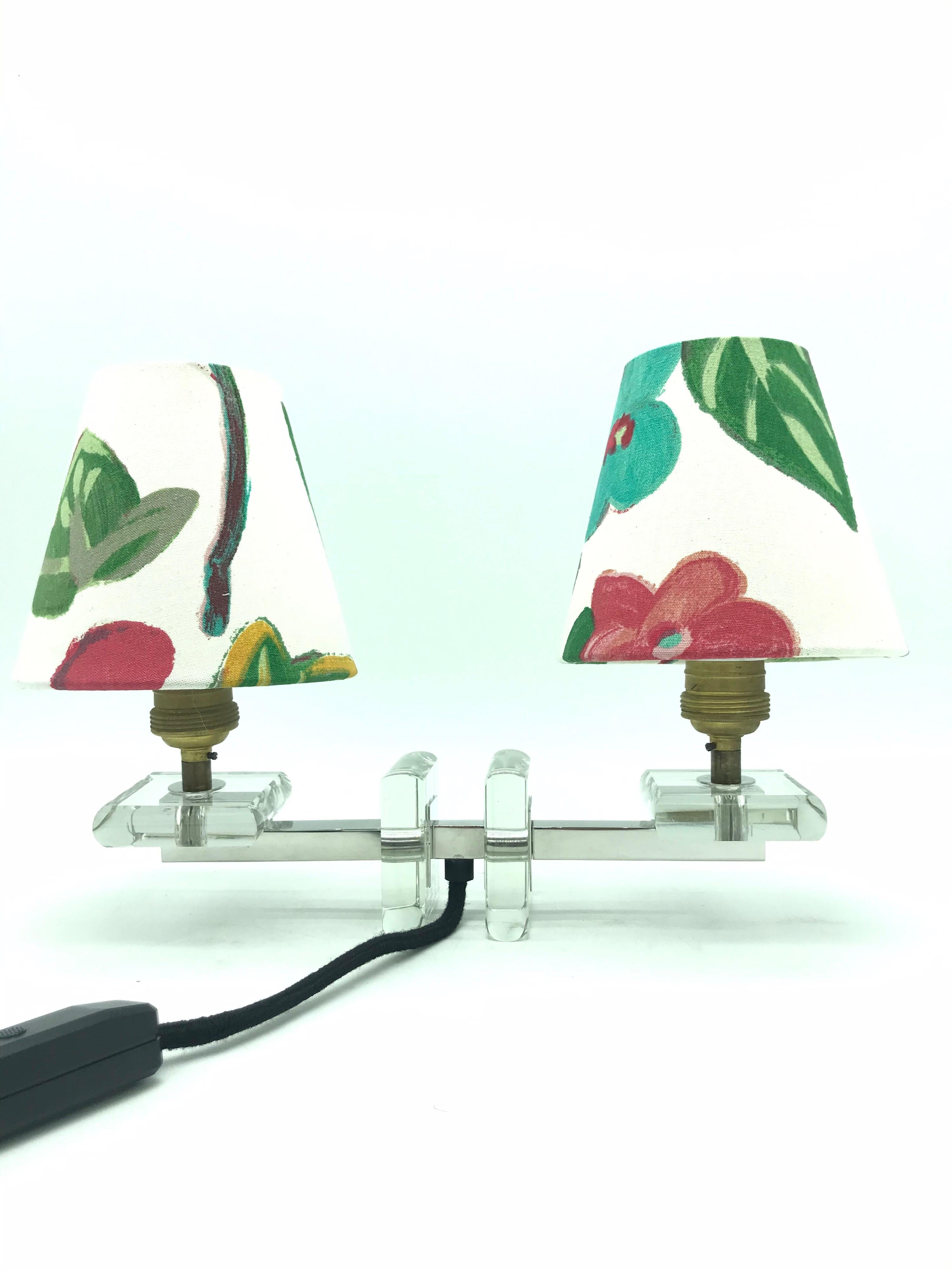 A very stylish French Art Deco table lamp in glass. 
This beautiful lamp is from the 1930s but has a very modernistic design. 
Rewired with an in-line dimmer switch. 
Also fitted with two handmade shades from ArtbyMaj in the style of Josef Frank.