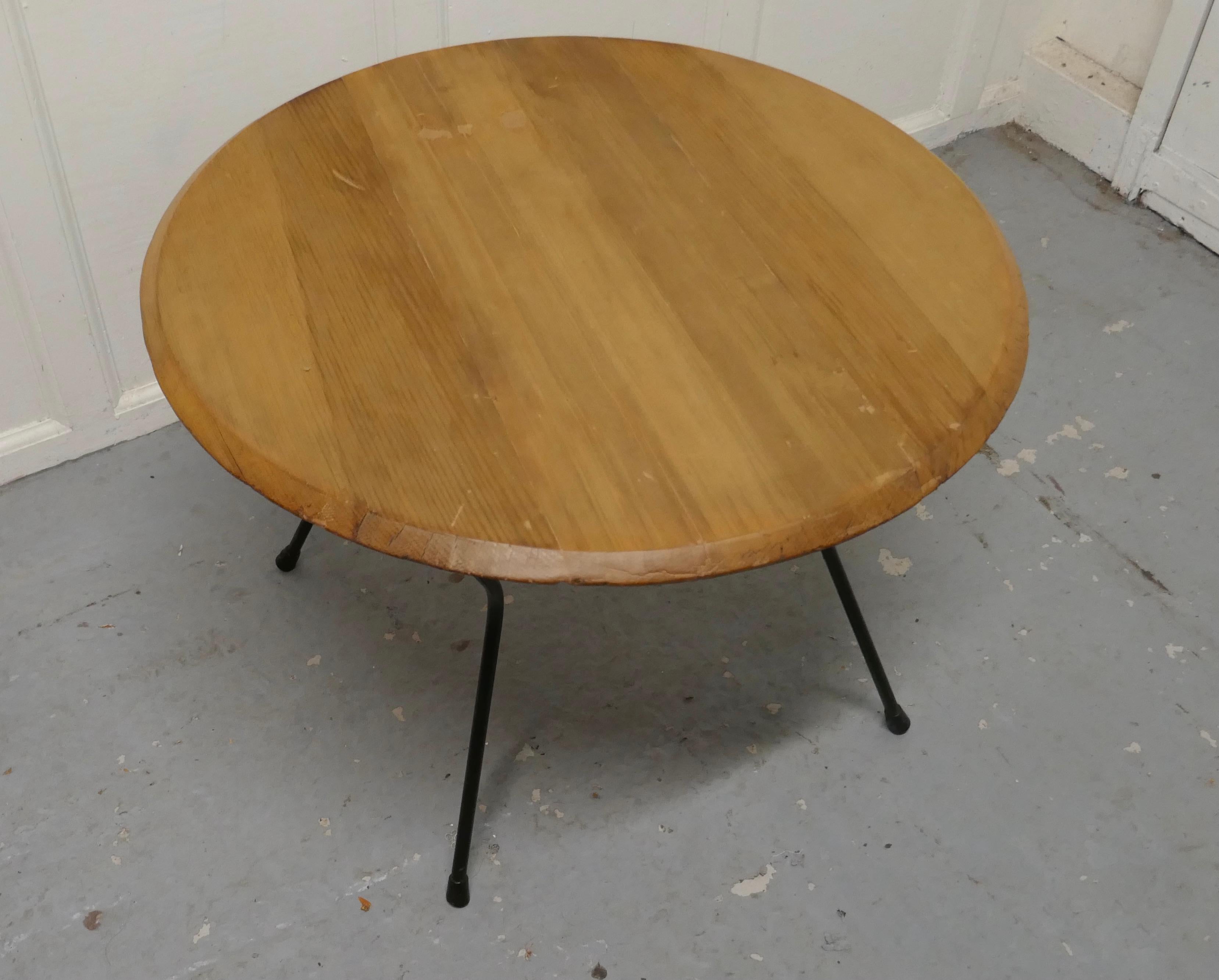 Very stylish round retro coffee table

This is a good sturdy table, it has a very attractive solid pine top. 
The base of the table is a traditional tubular bent leg design
The table is good and sound, it has been cleaned and refinished to give