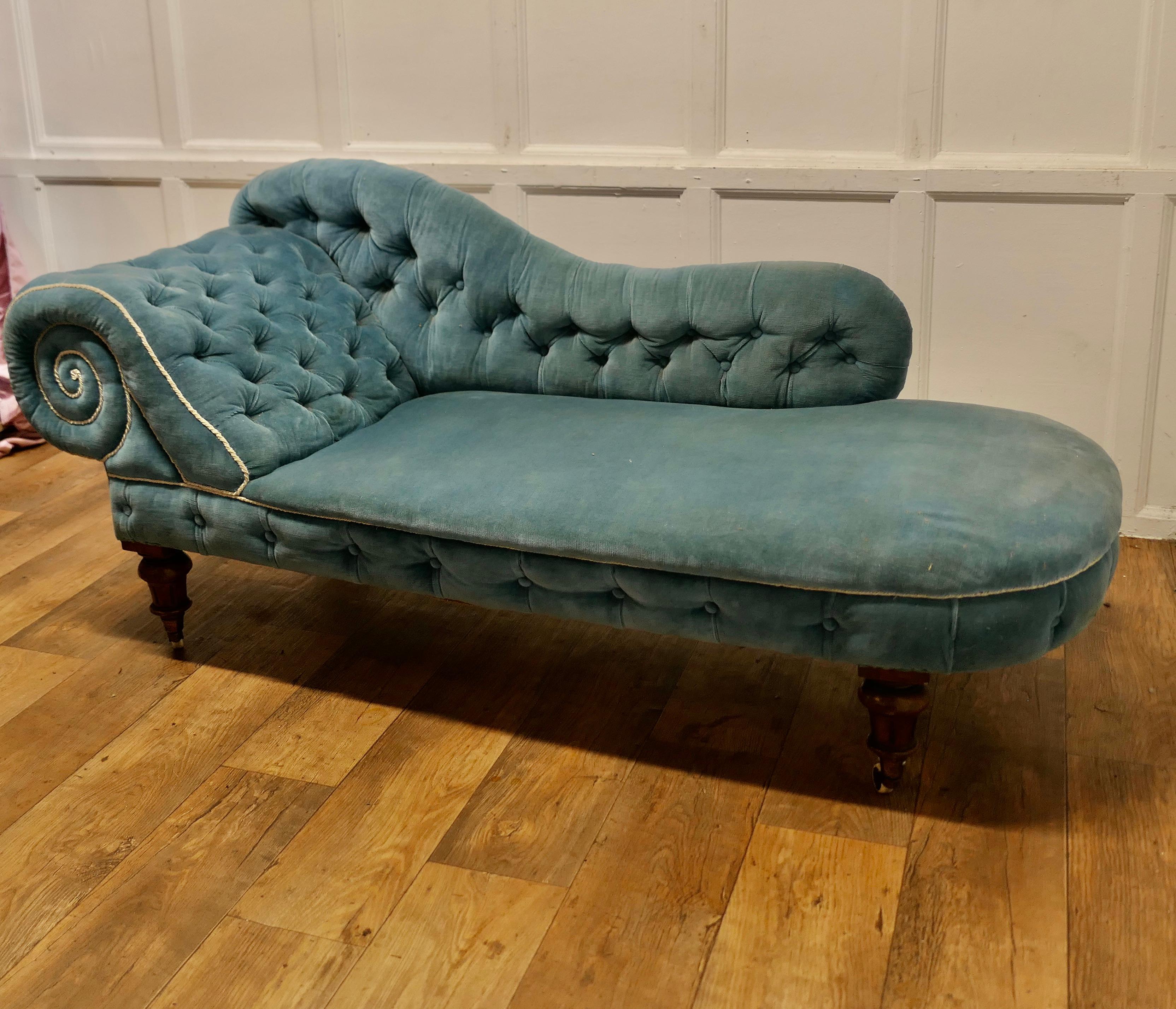 Very Stylish Victorian Velvet Chaise Longue or Day Bed

This is superb old sofa has an exaggerated swirl shaped back and head rest with deep buttoning, the back is also shaped and buttoned, it stands on chunky turned legs with castors, 
The Settee