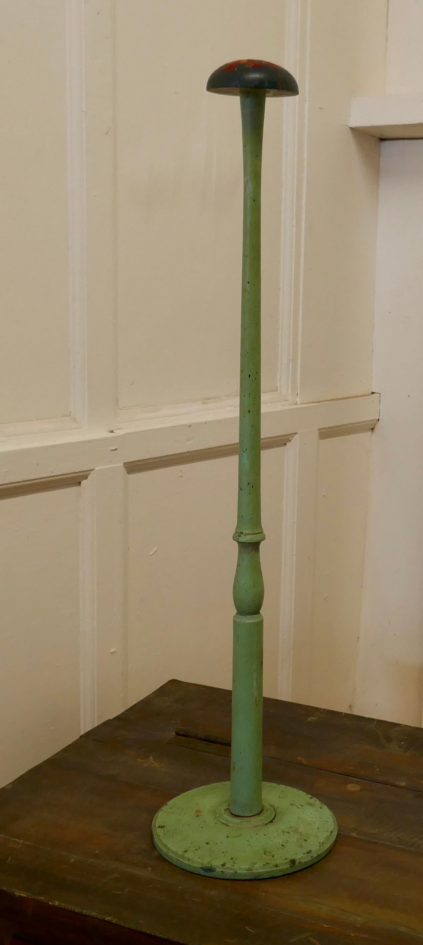 Very tall 19th century French Shabby original painted hat stand, shop display

The stand came from a milliners’ shop in France, it has a turned upright column set on a round turned base with a domed top rest
This one is in its original shady