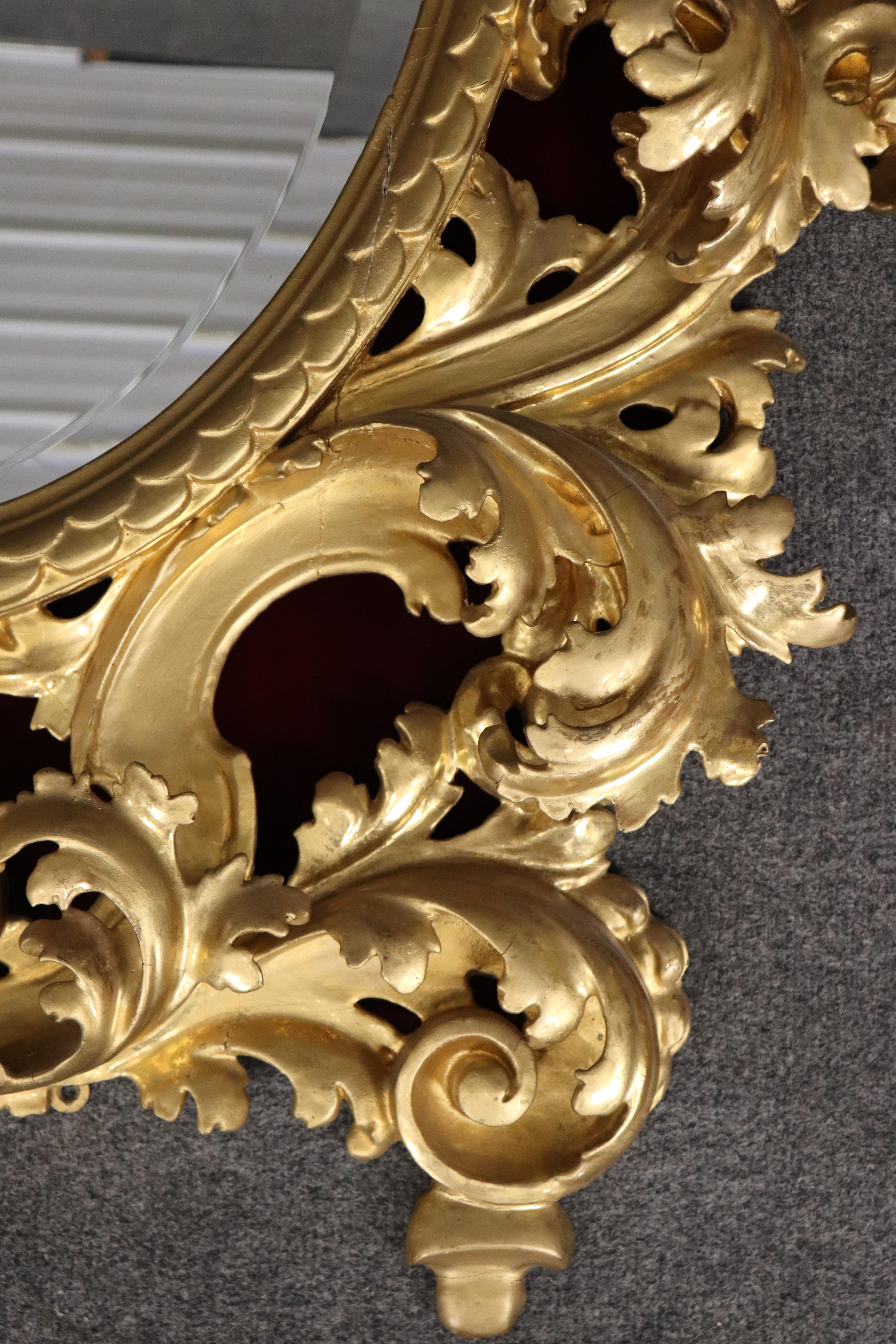 Neoclassical Revival Very Tall Carved Gilded Italian Florentine Oval Leaf Beveled Mirror For Sale