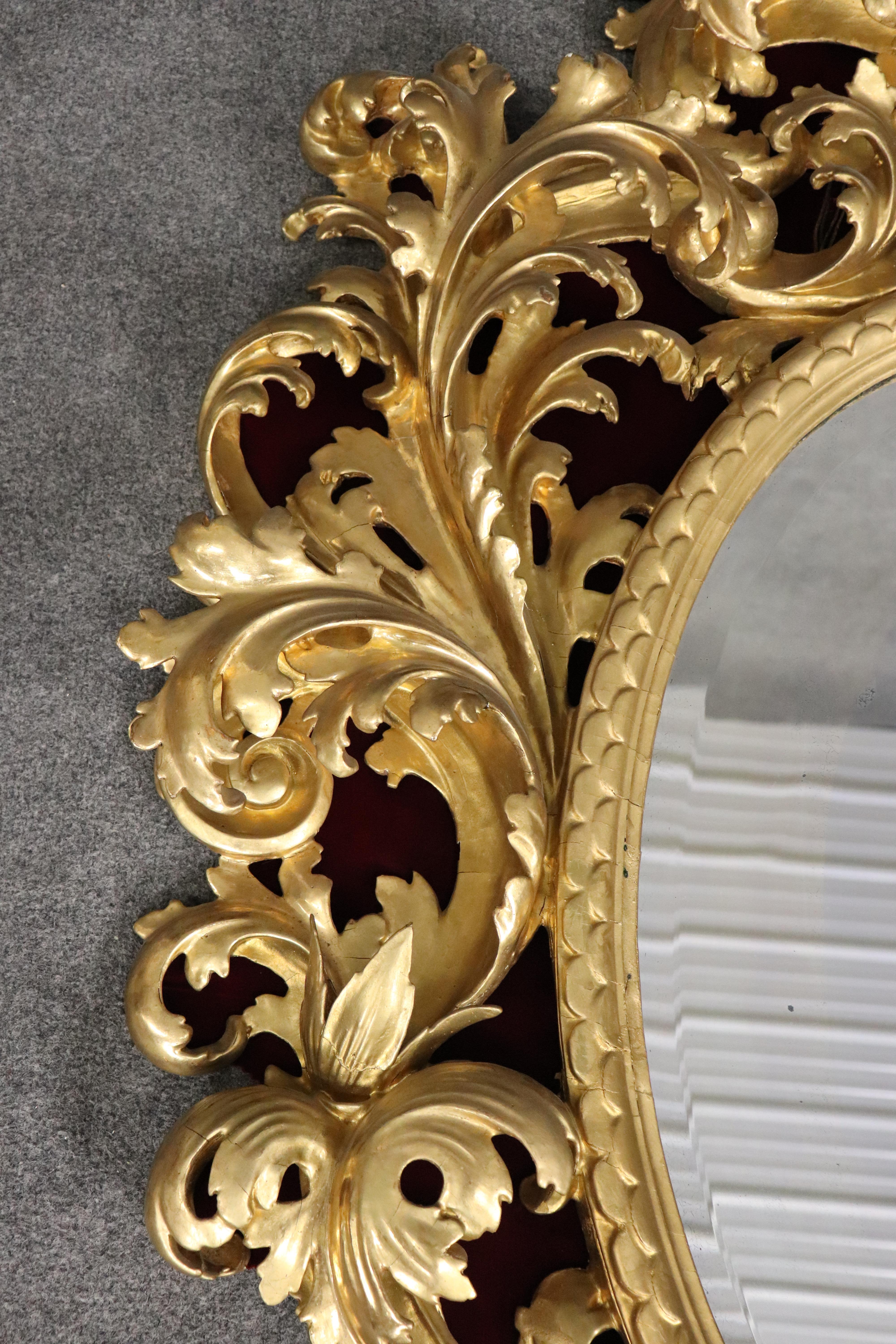 Very Tall Carved Gilded Italian Florentine Oval Leaf Beveled Mirror In Good Condition For Sale In Swedesboro, NJ