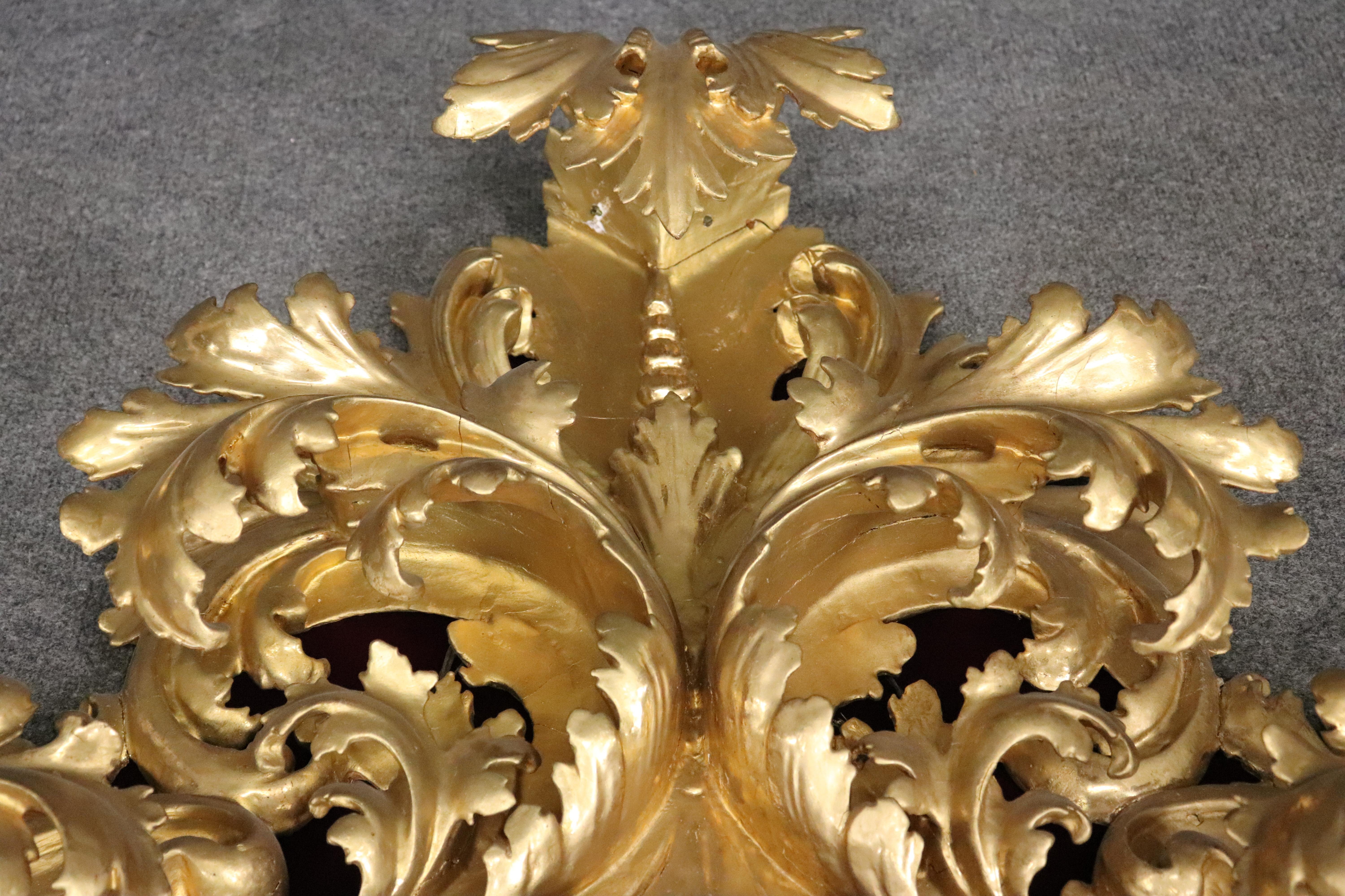 Mid-20th Century Very Tall Carved Gilded Italian Florentine Oval Leaf Beveled Mirror For Sale