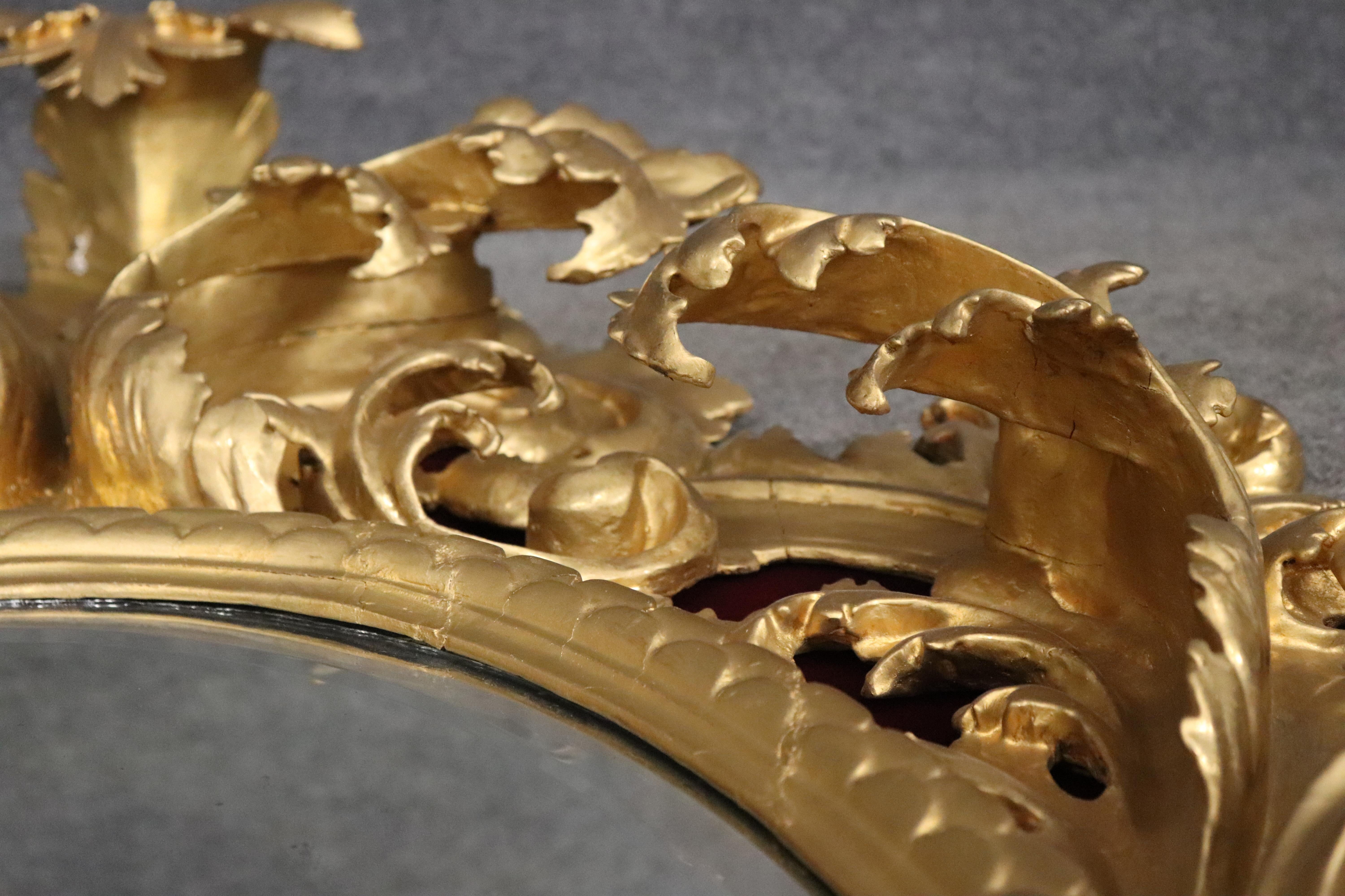 Pine Very Tall Carved Gilded Italian Florentine Oval Leaf Beveled Mirror For Sale