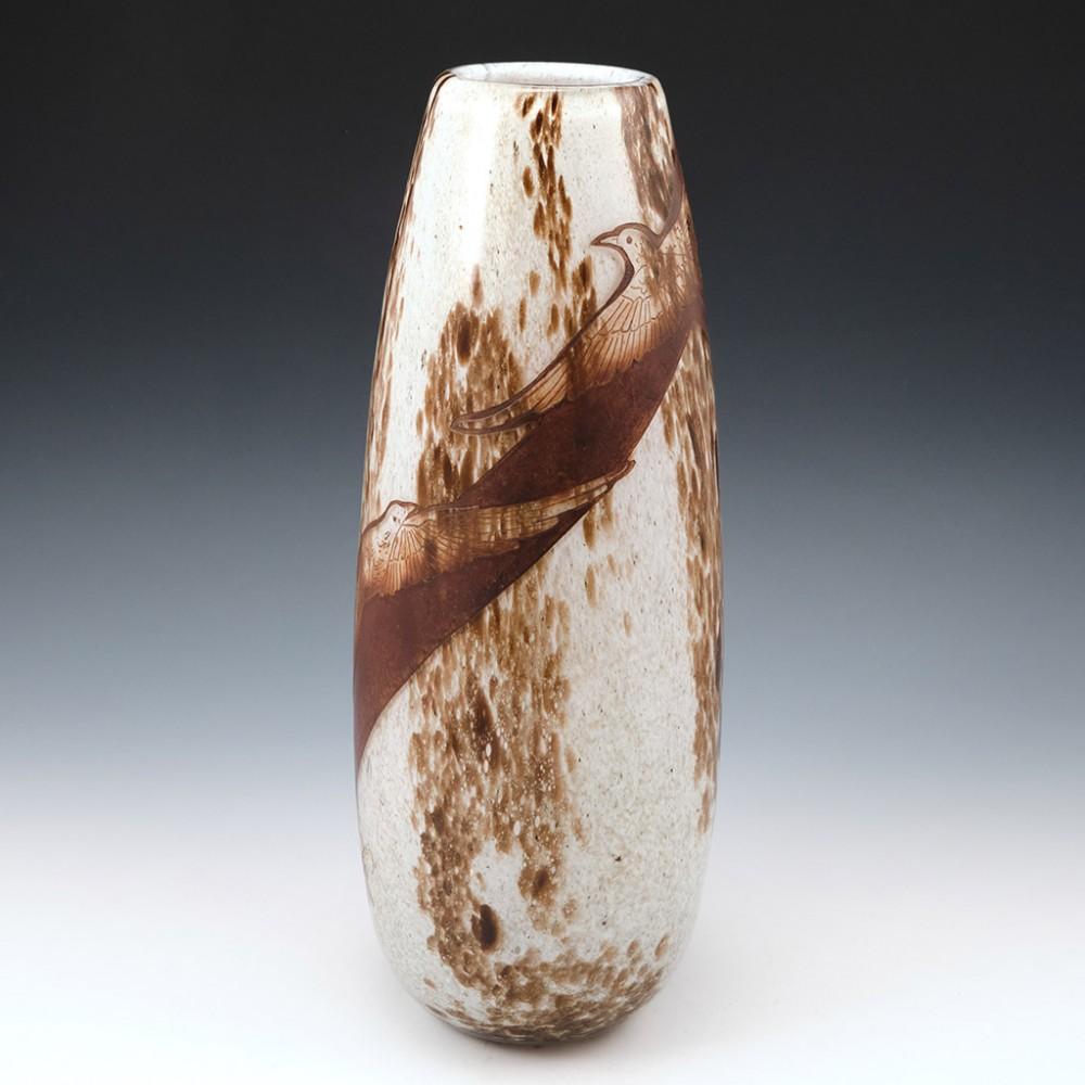 Very Tall Legras Art Deco Vase, c1925

Legras operated two glassworks in the Paris suburbs at both Pantin and St Denis. This post war vase emulates acid etched cameo. The outer layer is clear glass over mottled brown. The decorative band is cut into