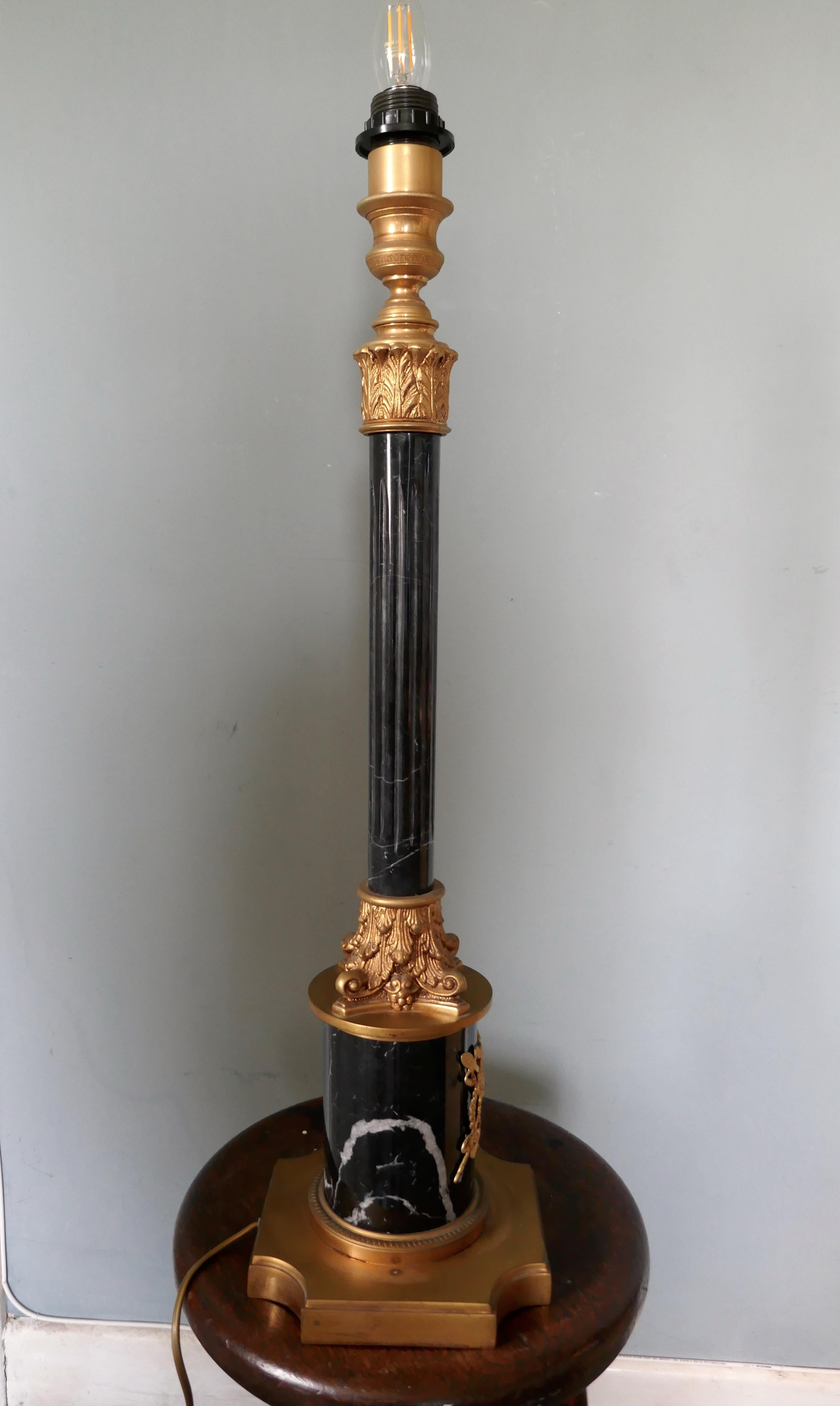 Very Tall Marble Corinthian Column Table Lamp

This is very heavy piece it is made in solid marble and brass, the lamp has a single fluted marble corinthian style columns set on a marble and brass base
This is a very attractive piece larger than