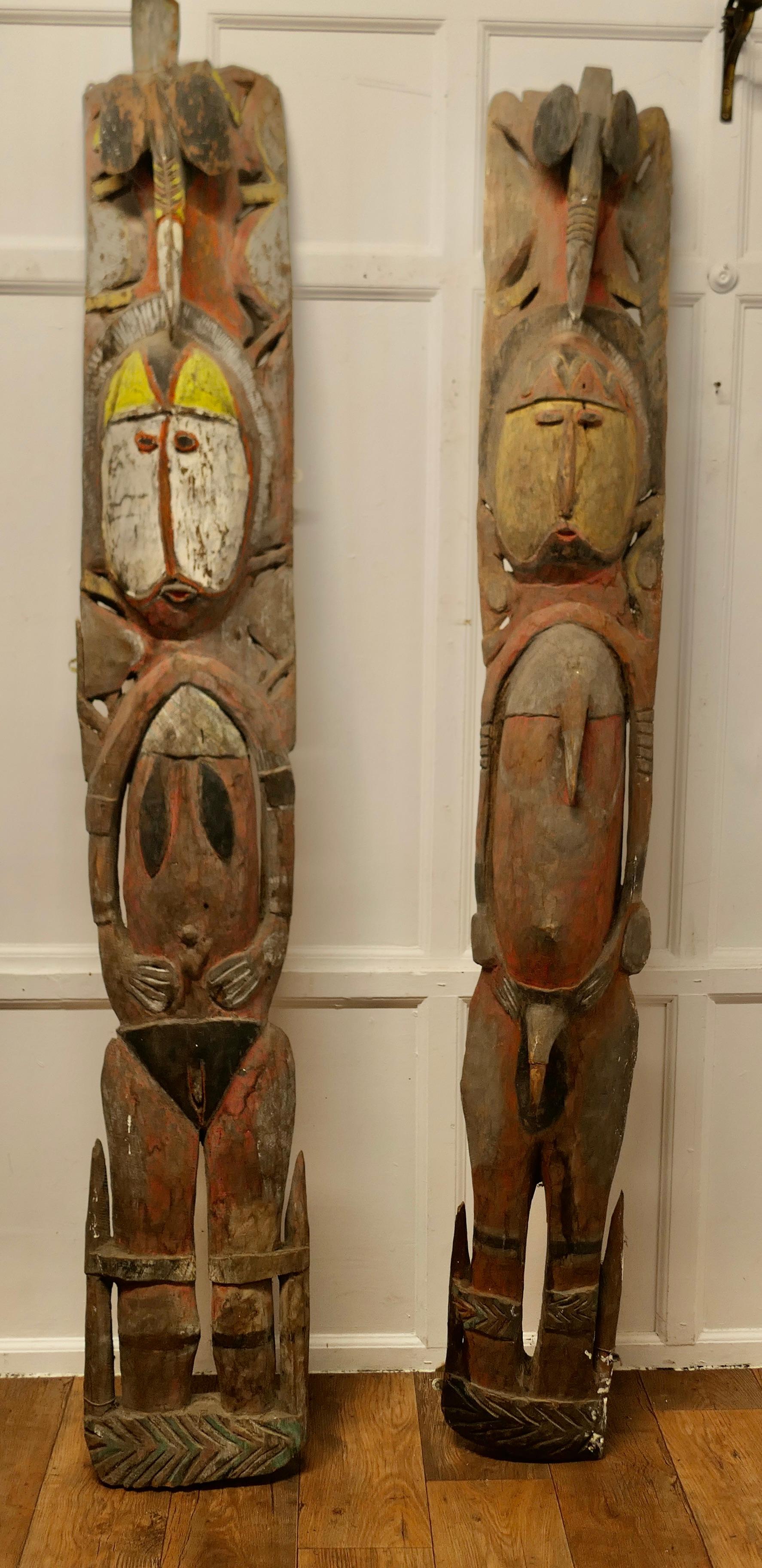 Very Tall Pair of African Marriage Figure Panels

This is a very heavy pair of large full-length figures, wall panels, they are African, carved and polychrome painted, modelled as a male and female
Both figures have a toucan at the top above